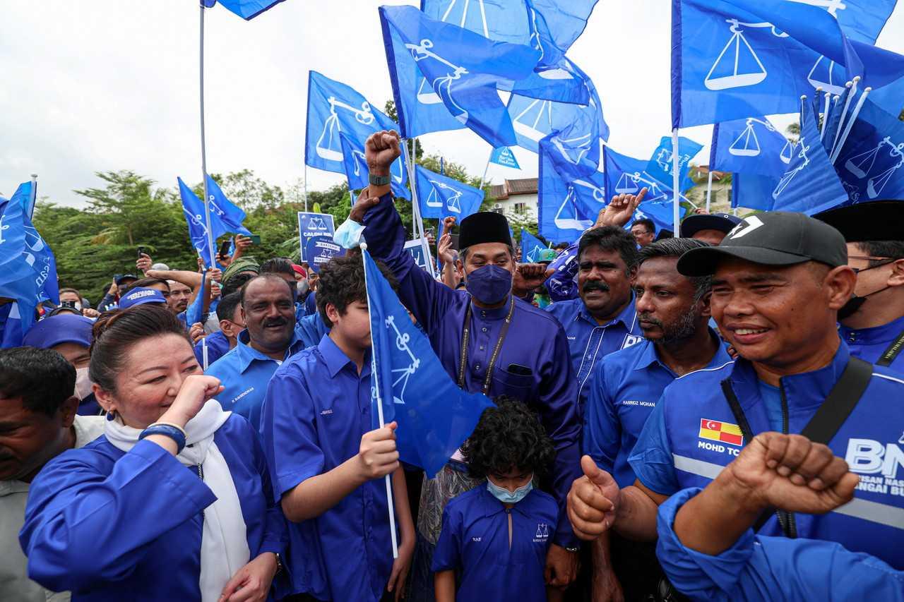 Barisan Nasional's Khairy Jamaluddin raises his fist with supporters on nomination day in Sungai Buloh on Nov 5. Photo: Bernama