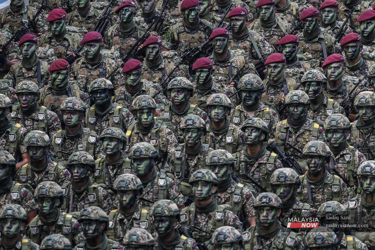 Armed forces personnel march at the country's 65th independence celebration at Dataran Merdeka in Kuala Lumpur on Aug 31. 
