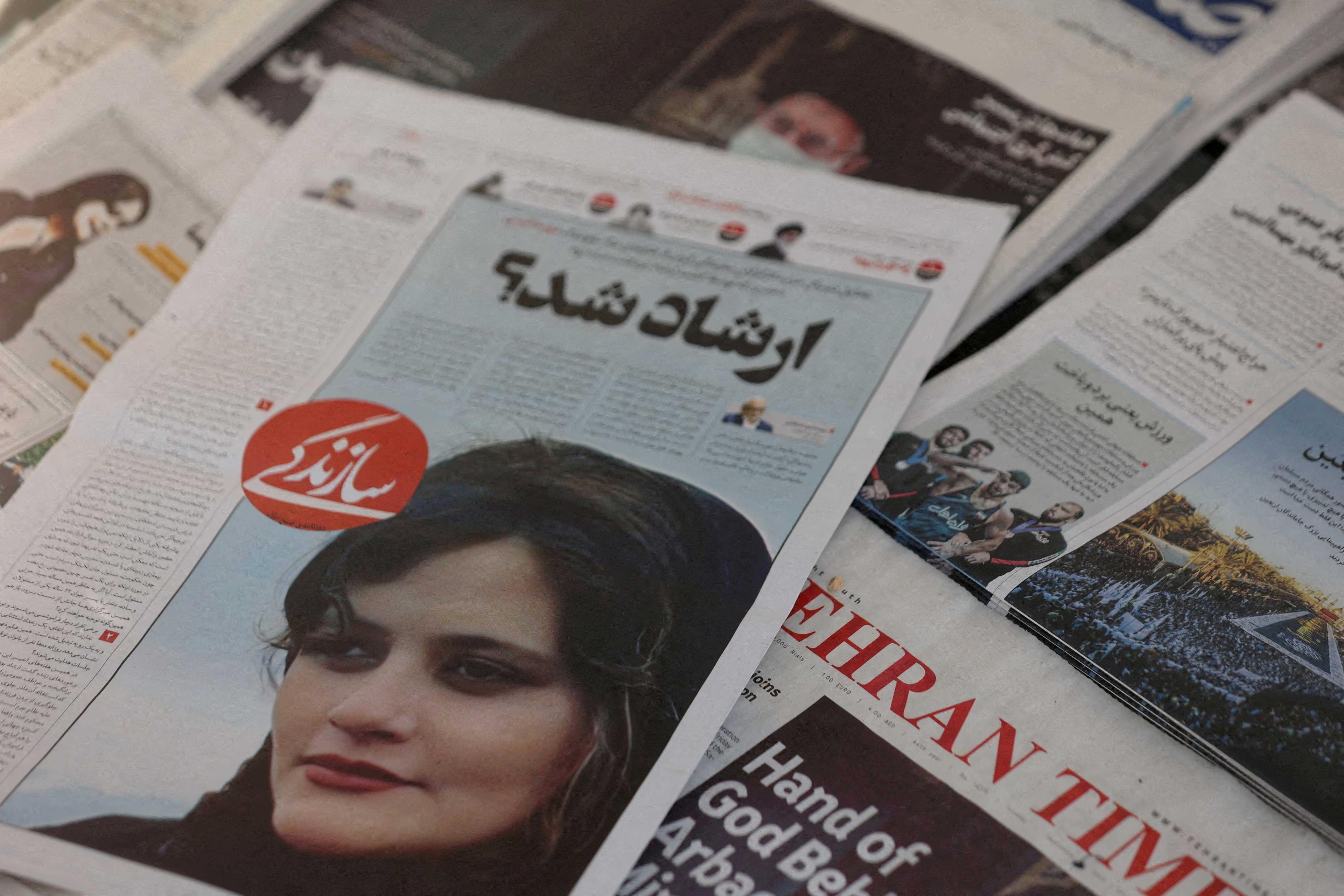A newspaper with a cover picture of Mahsa Amini, a woman who died after being arrested by Iranian morality police is seen in Tehran, Iran, Sept 18. Photo: Reuters