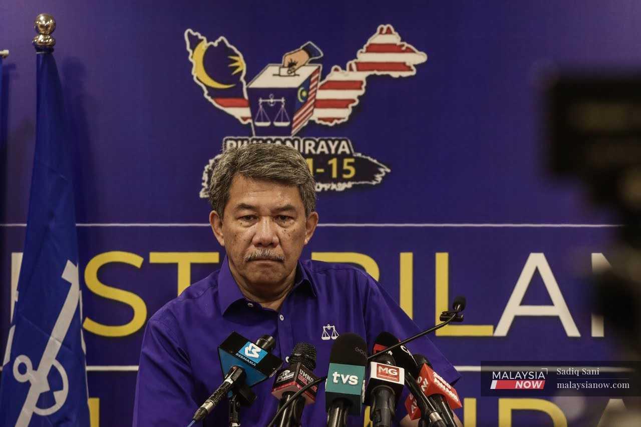 Umno deputy president Mohamad Hasan speaks at a press conference in Kuala Lumpur today. 