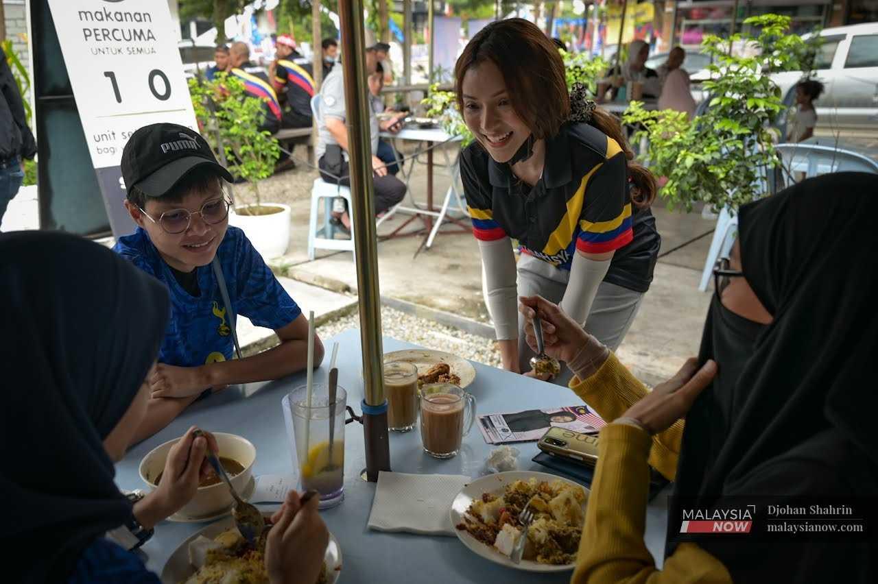 Independent candidate Nur Fathiah Syazwana Shaharudi, popularly known as Cleopatra, canvasses for support in Batu ahead of the Nov 19 election.