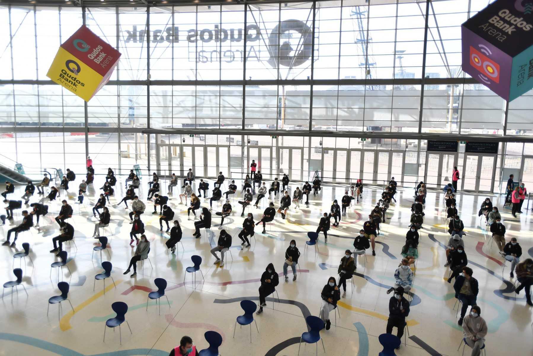 Students wait for their turn to receive their first dose of the Pfizer Covid-19 vaccine in Sydney, Australia, on Aug 9, 2021. Photo: AFP