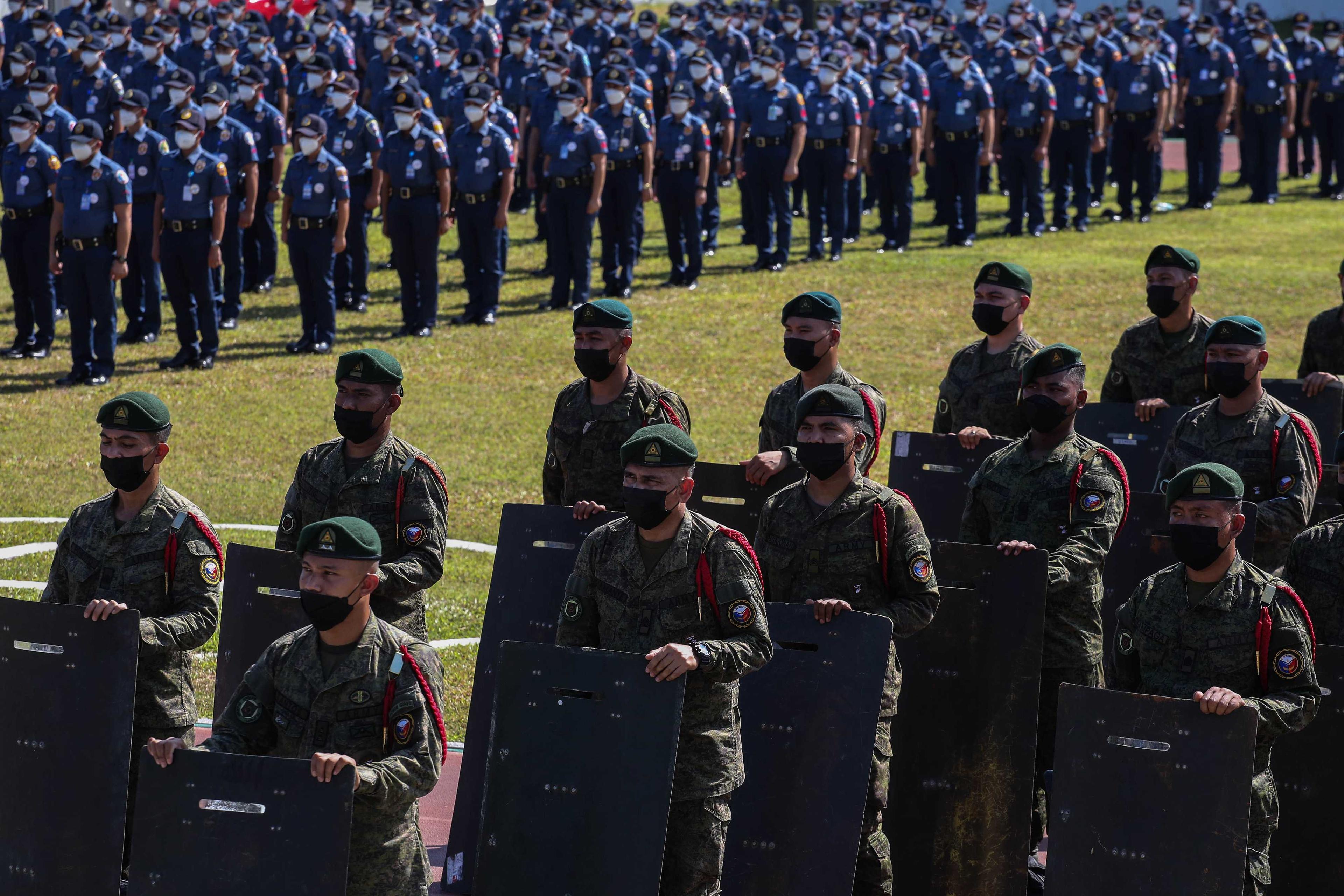 Members of the Philippine military and police services attend a ceremonial send-off as they are deployed for security duty ahead of the May 9 presidential election, at Camp Crame in Quezon City, suburban Manila on May 4. Photo: AFP 