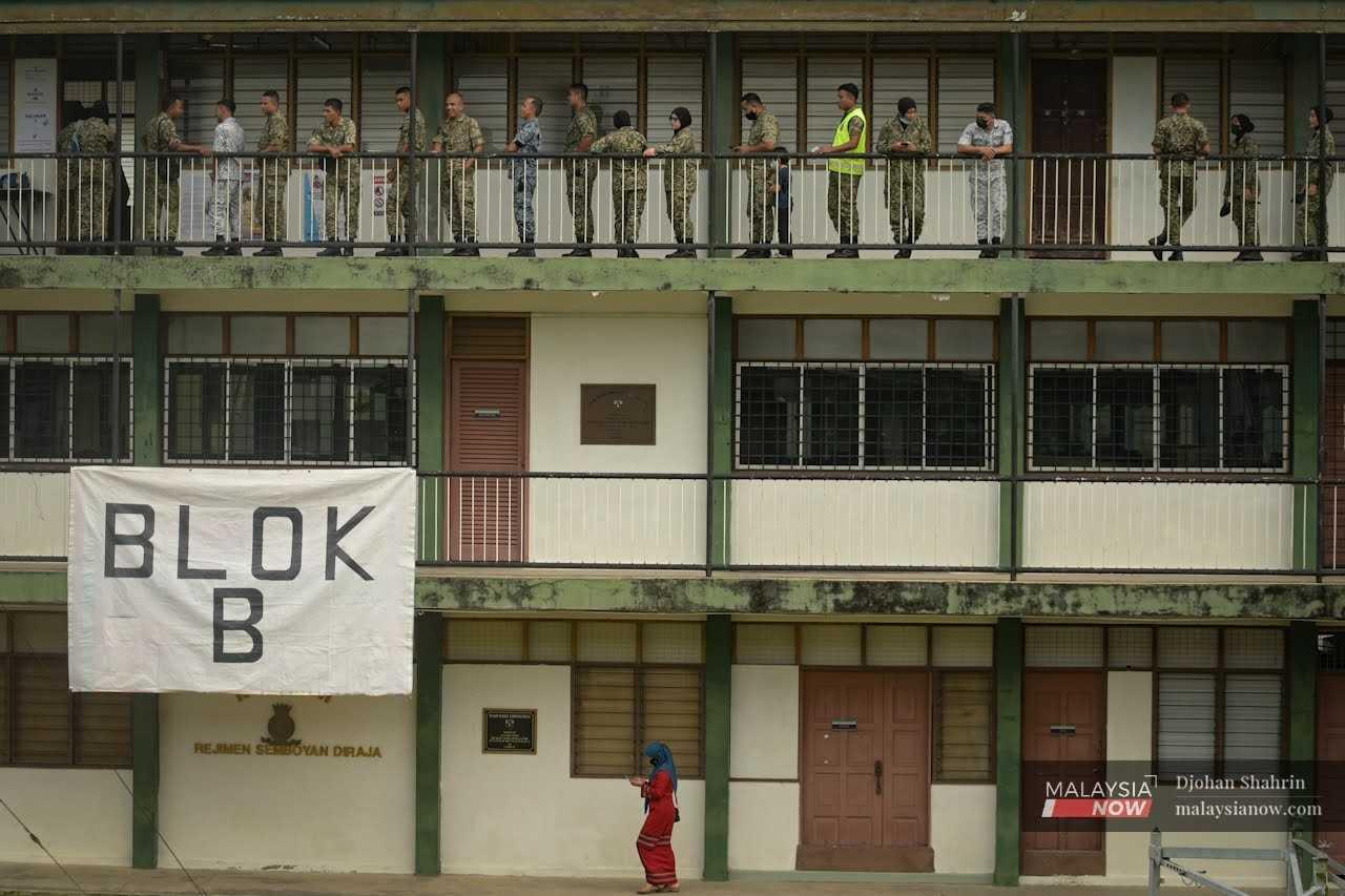Military personnel participate in early voting at the Sungai Besi camp in Kuala Lumpur.