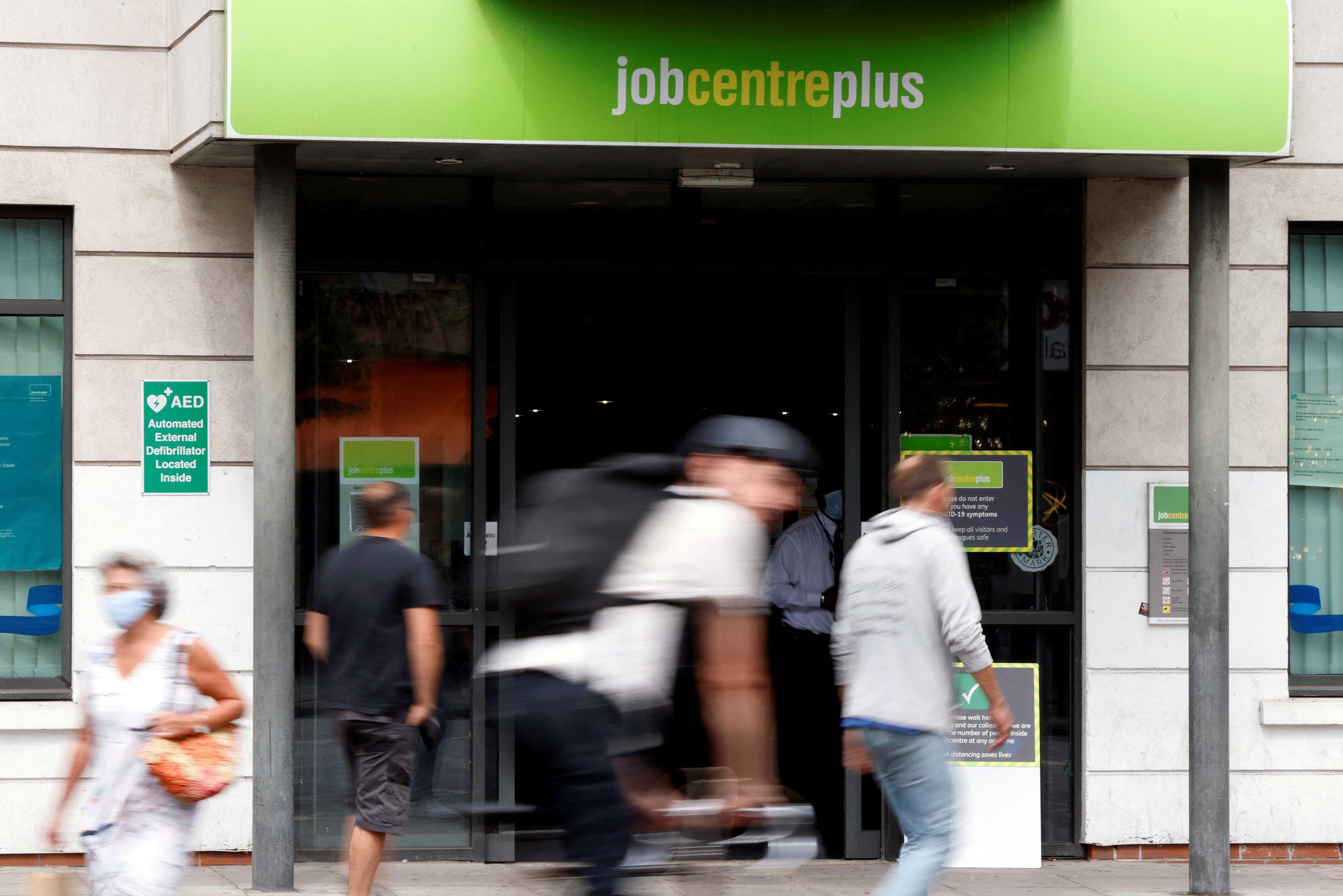 People walk past a branch of Jobcentre Plus, a government run employment support and benefits agency, as the outbreak of Covid-19 continues, in Hackney, London, Britain, Aug 6. Photo: Reuters