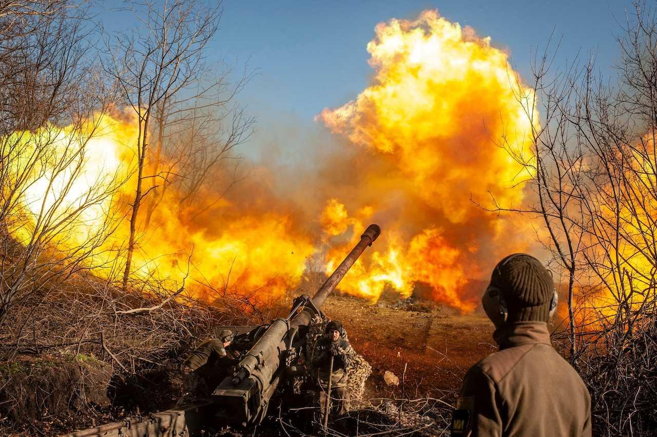 Ukrainian servicemen fire a 130mm towed field gun M-46 on a front line, as Russia's attack on Ukraine continues, near Soledar, Donetsk region, Ukraine, in this handout image released Nov 10. Photo: Reuters 