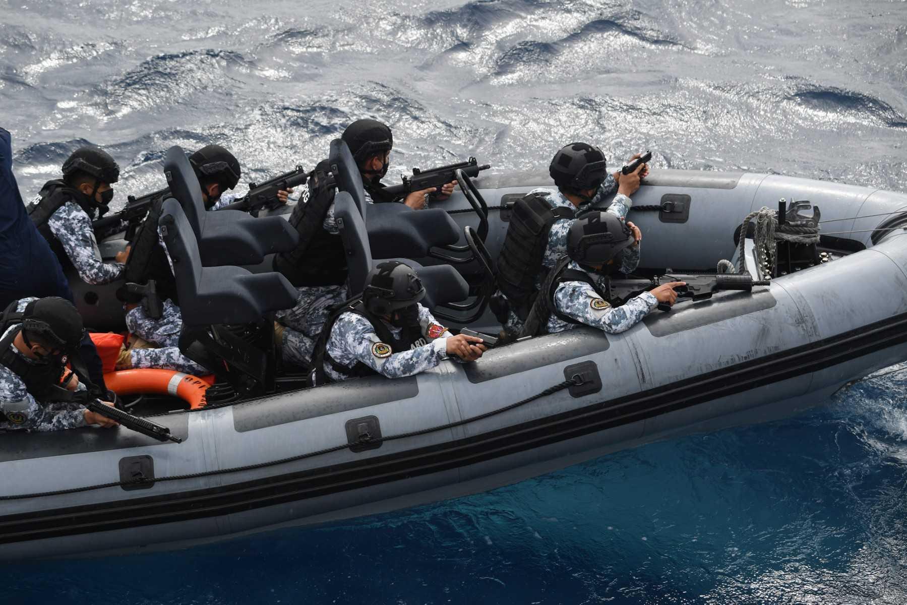 Members of the Maritime Security and Enforcement Command of the Philippine Coast Guard take part in an anti-piracy drill off Bataan on Sept 3. Photo: AFP 