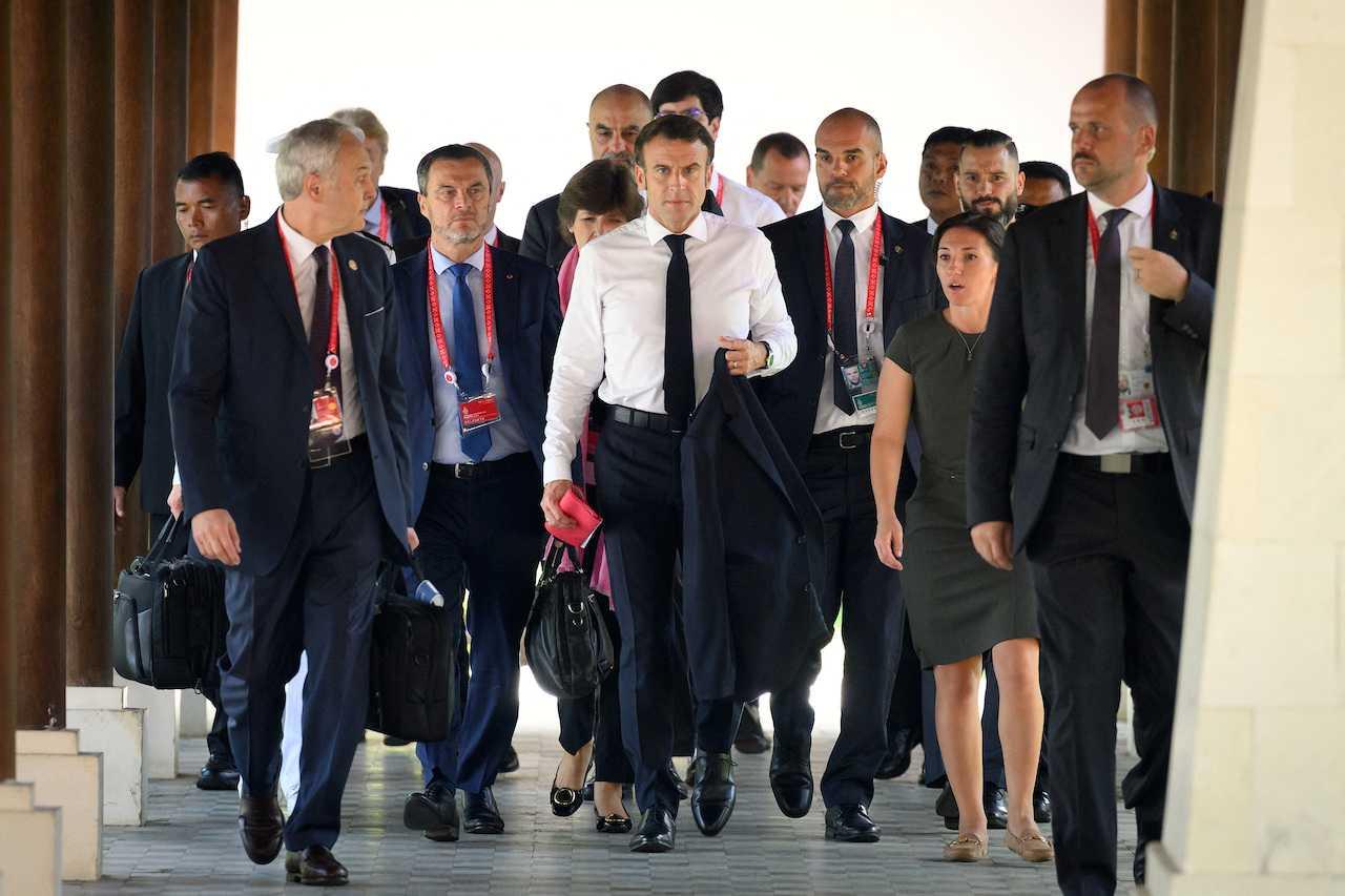 President Emmanuel Macron of France arrives ahead of an emergency meeting of leaders at the G20 summit in Nusa Dua, Indonesia, Nov 16. Photo: Reuters 