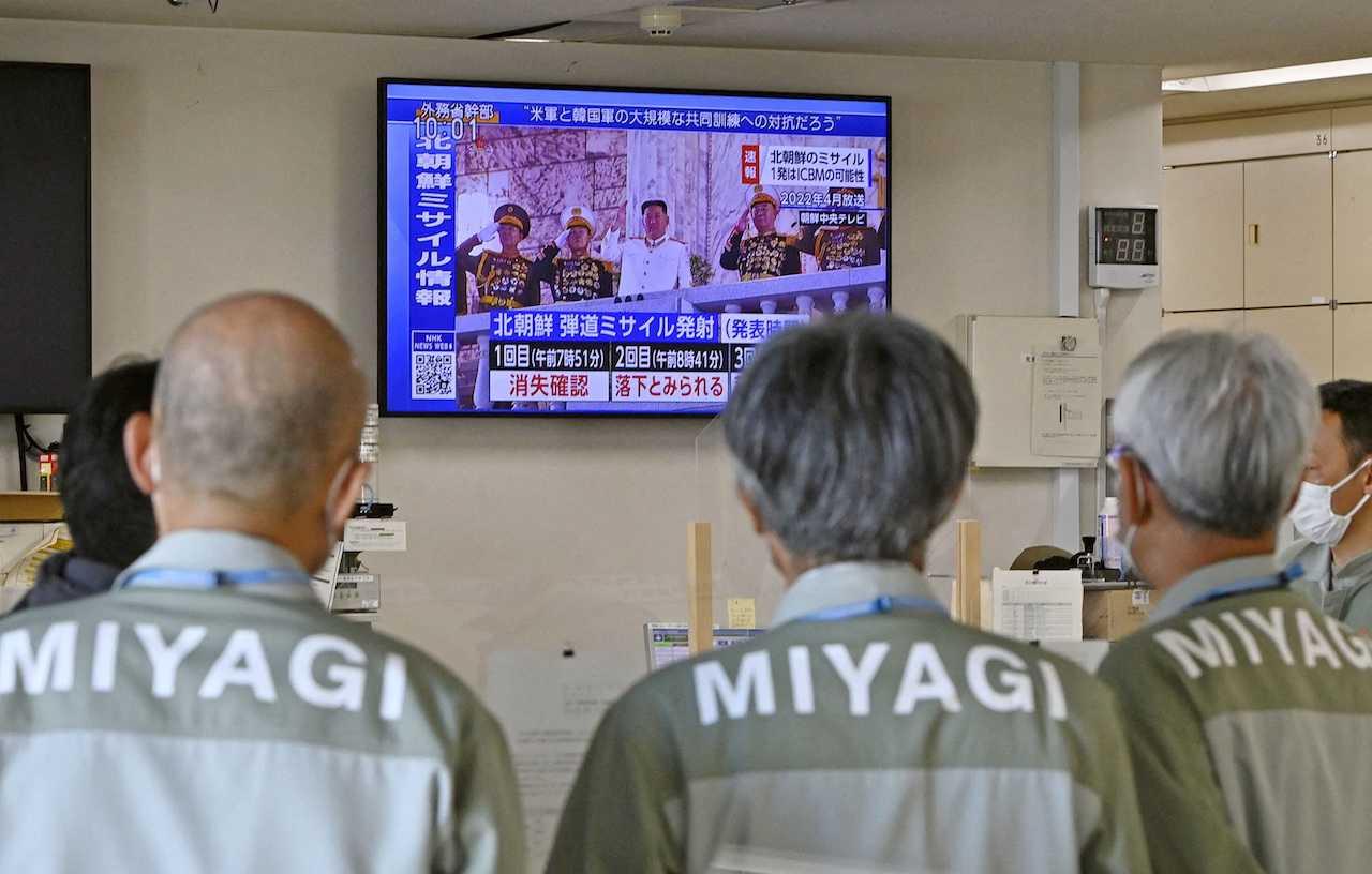 Miyagi prefectural government officials watch a TV news about North Korea's firing of ballistic missiles at the office in Sendai, Miyagi prefecture, Japan in this photo taken by Kyodo on Nov 3. Photo: Reuters