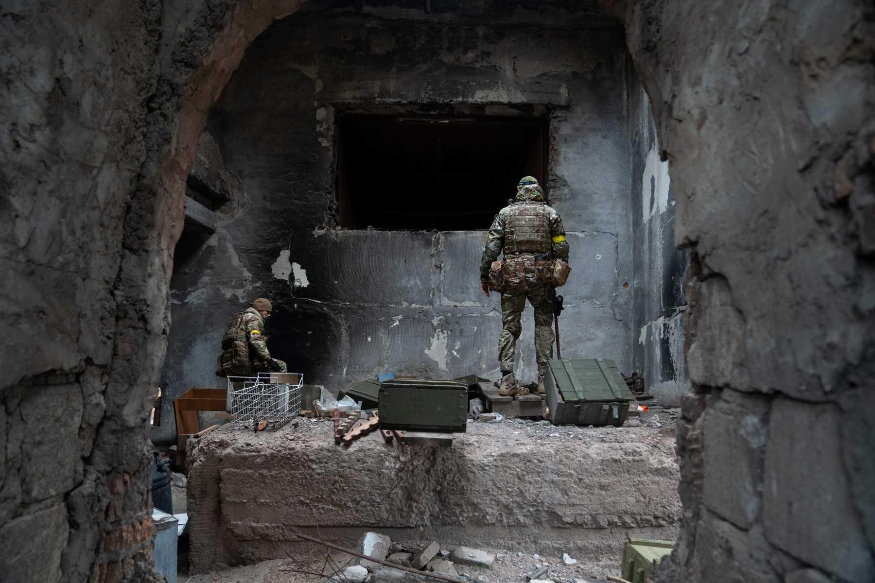 A Ukraine police demining unit check the area of a grain elevator facility used as a Russian military base during the occupation in Snihurivka, Mykolaiv region, on Nov 16. Photo: AFP