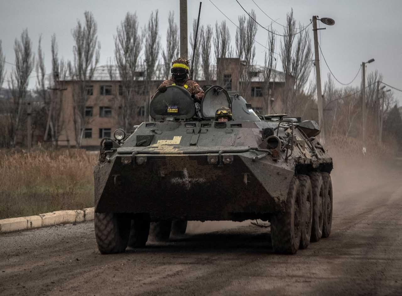 Ukrainian servicemen ride an armoured personnel carrier, as Russia's attack in Ukraine continues, in Siversk, Donetsk region, Ukraine, Nov 6. Photo: Reuters