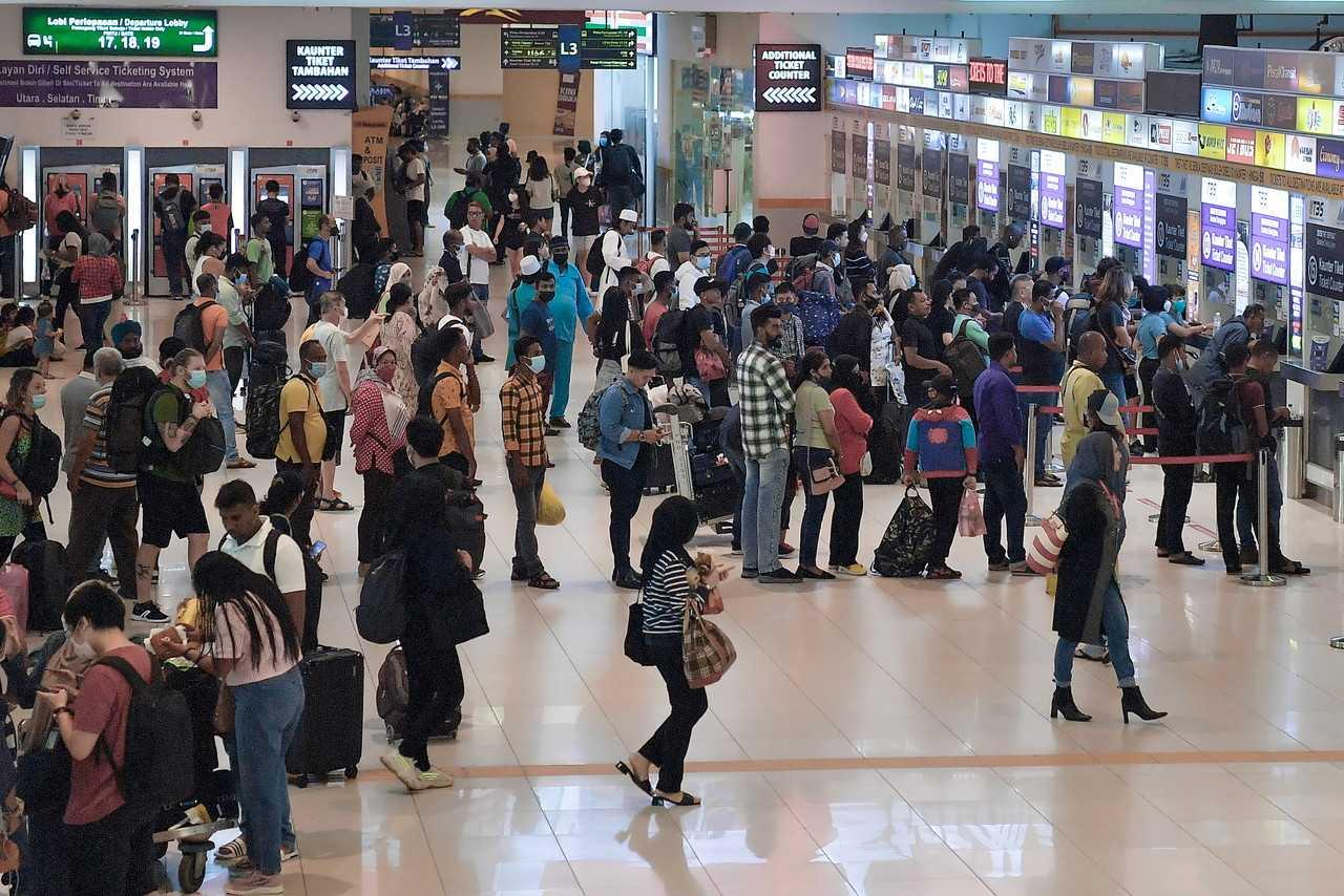 Travellers queue at the ticket counter at Terminal Bersepadu Selatan in Kuala Lumpur today. Photo: Bernama
