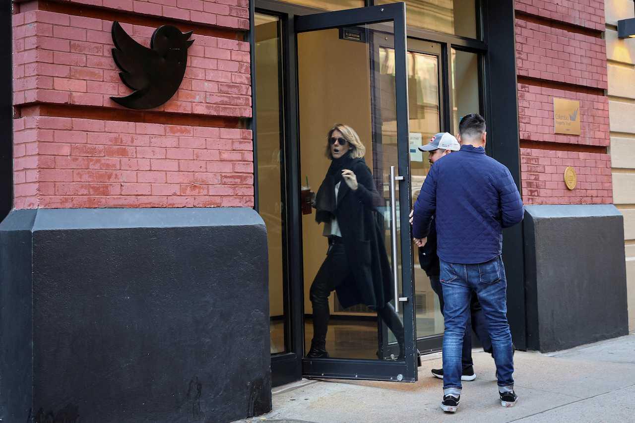 Twitter employees are seen entering the offices in New York City, US, Nov 9. Photo: Reuters