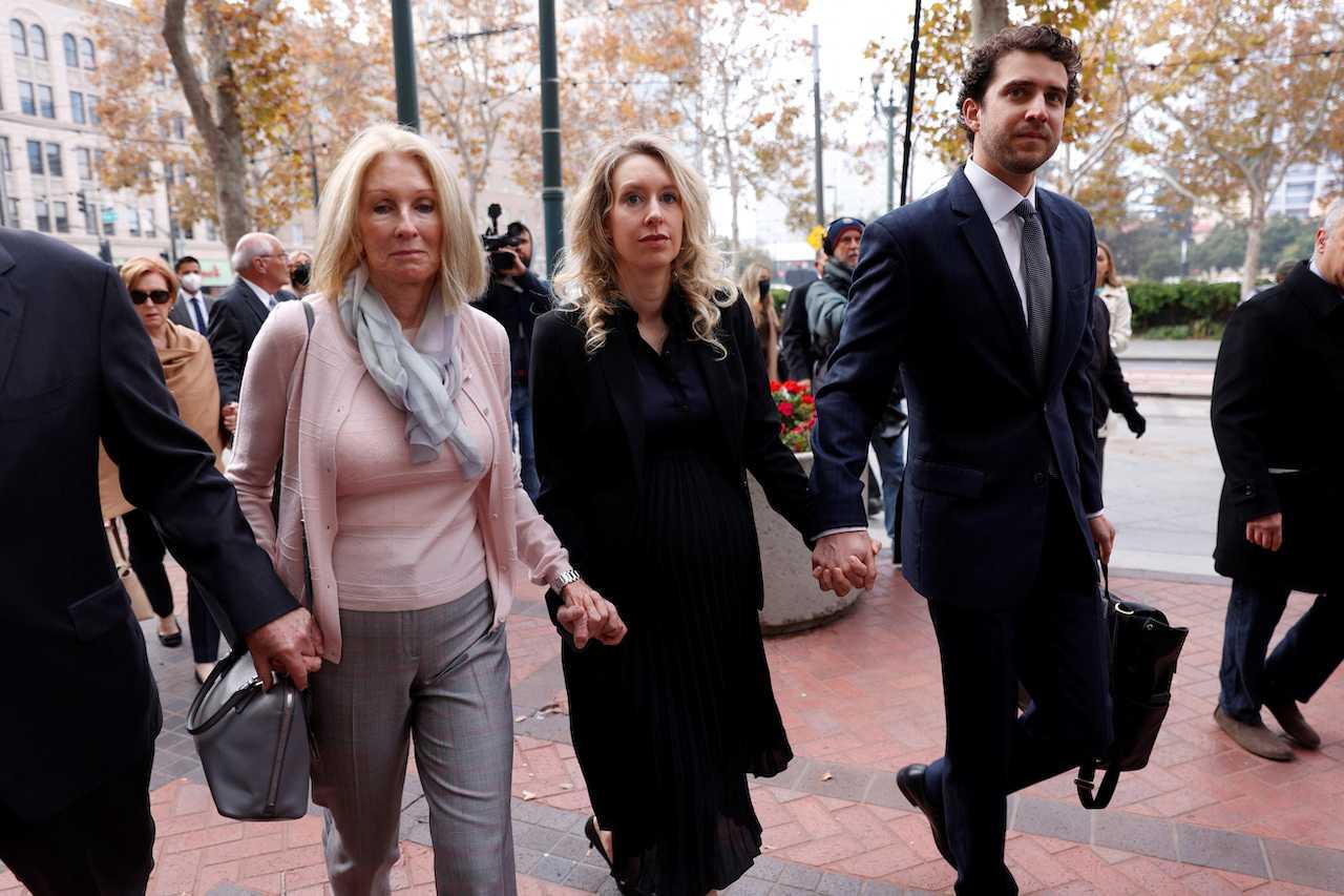 Theranos founder Elizabeth Holmes arrives with her family to be sentenced on her convictions for defrauding investors in the blood testing startup at the federal courthouse in San Jose, California, US, Nov 18. Photo: Reuters