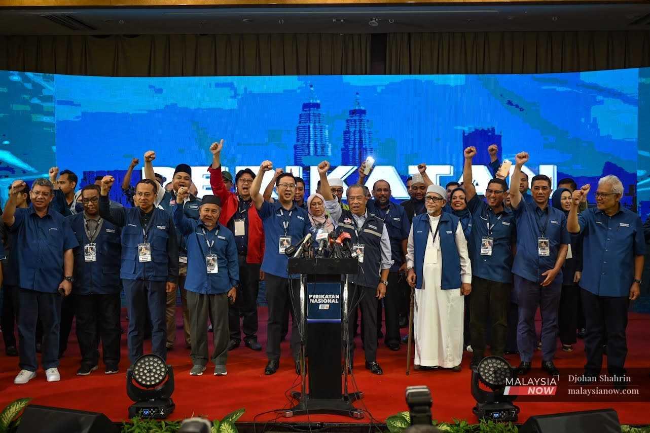 Perikatan Nasional chairman Muhyiddin Yassin with other coalition leaders at Glenmarie in Shah Alam. 
