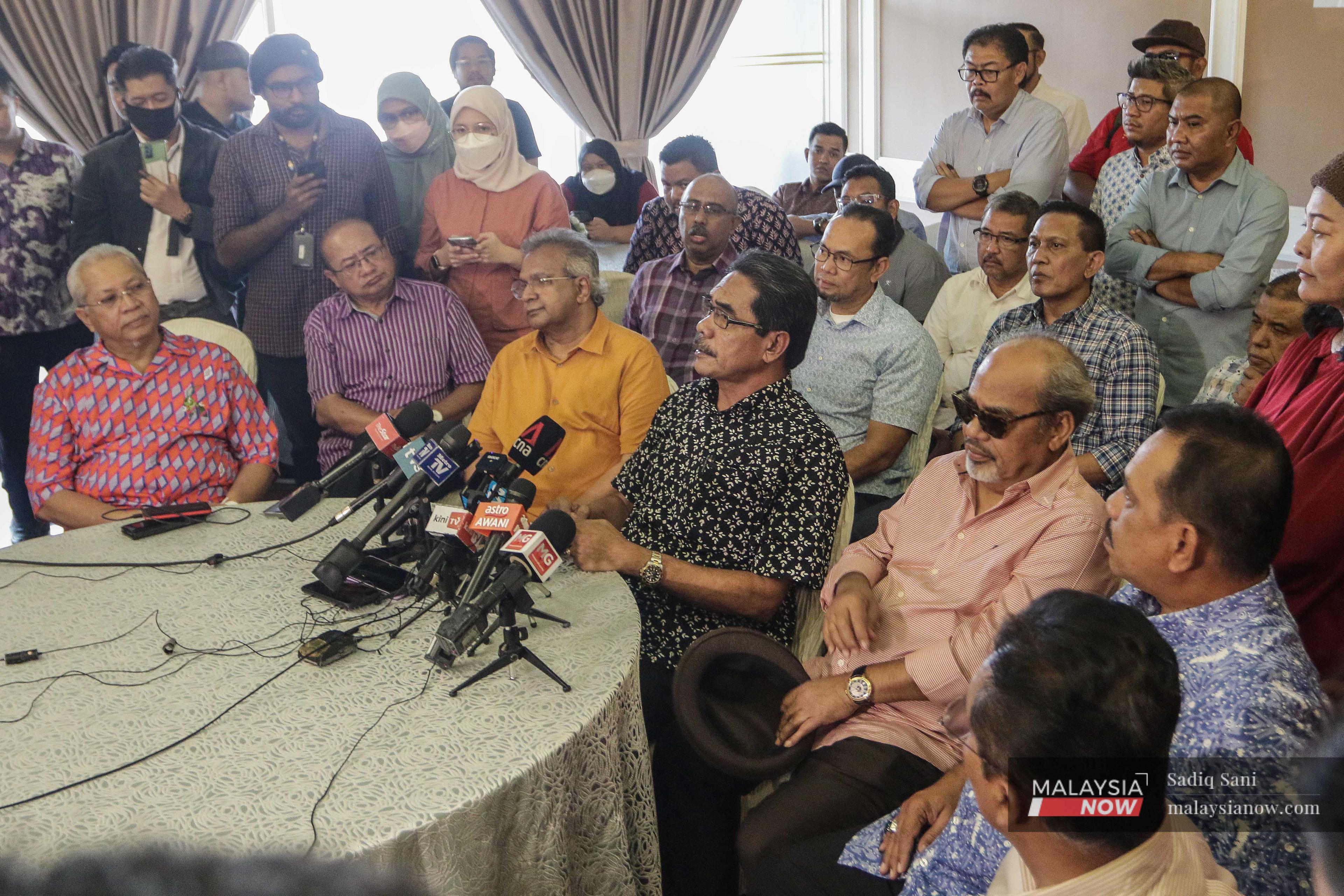 Umno division leaders attend a press conference at the World Trade Centre in Kuala Lumpur today. 
