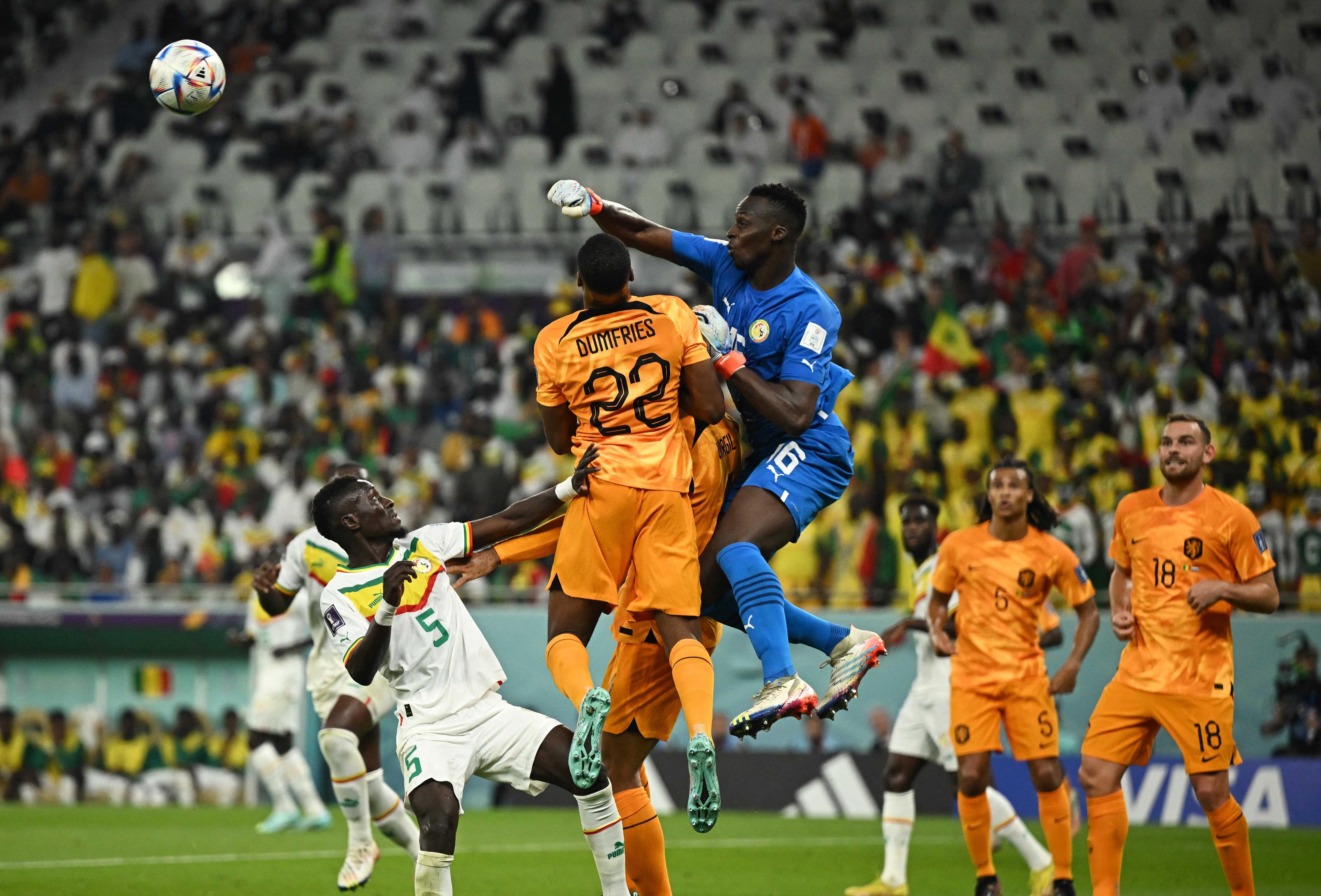 Fifa World Cup Qatar 2022 - Group A - Senegal v Netherlands - Al Thumama Stadium, Doha, Qatar - Nov 21, Senegal's Edouard Mendy and Idrissa Gana Gueye in action with Netherlands' Denzel Dumfries. Photo: Reuters