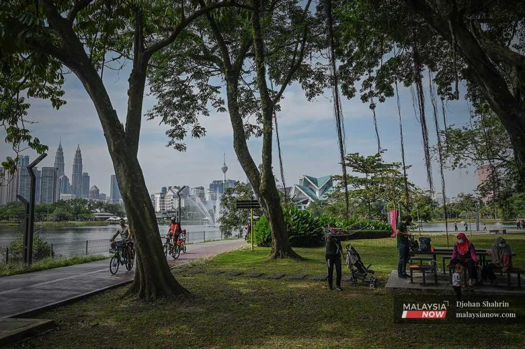Families enjoy a day out at Taman Tasik Titiwangsa in Kuala Lumpur.