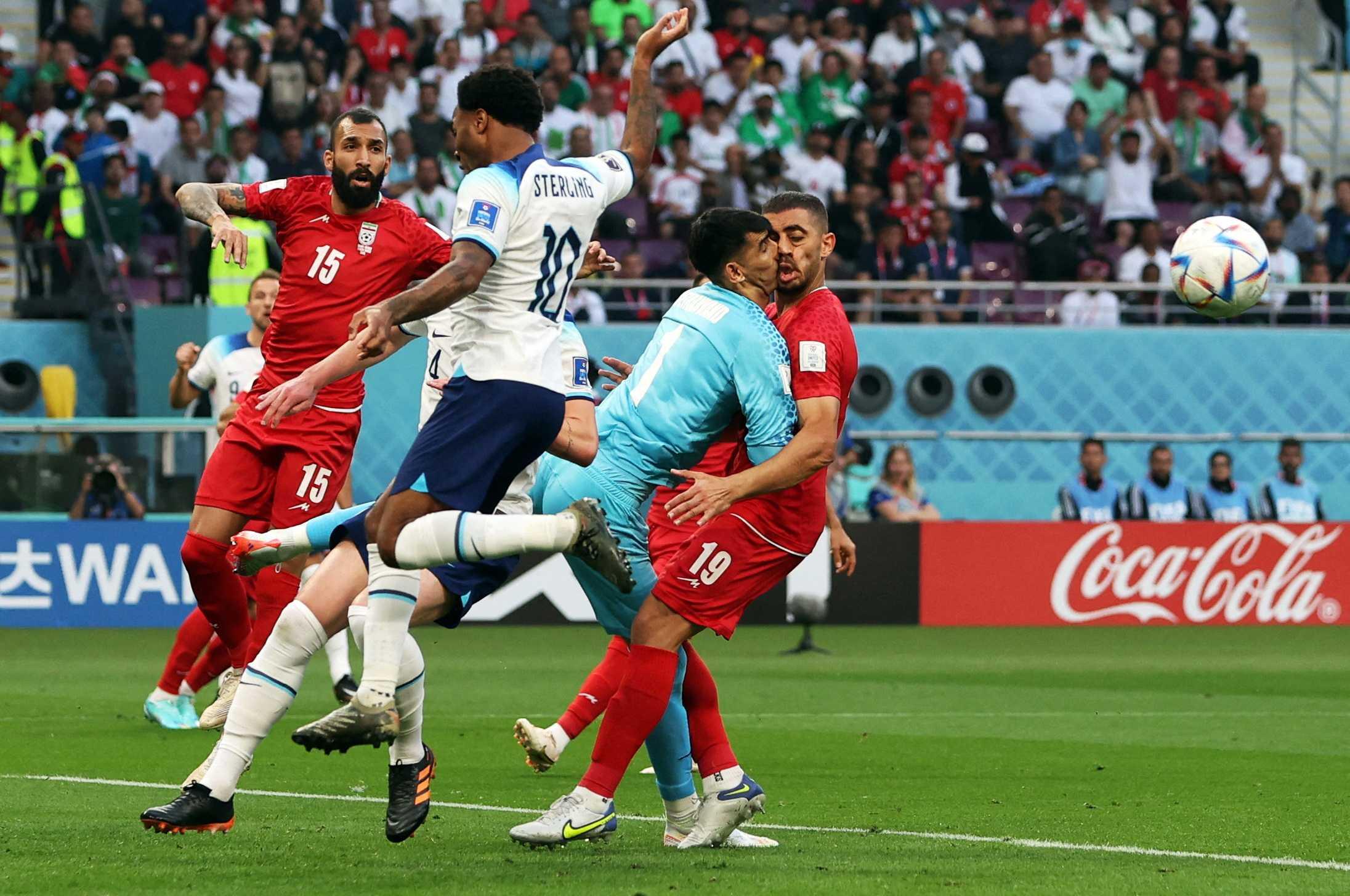 Fifa World Cup Qatar 2022 - Group B - England v Iran - Khalifa International Stadium, Doha, Qatar - Nov 21, Iran's Alireza Beiranvand collides with Majid Hosseini. Photo: Reuters