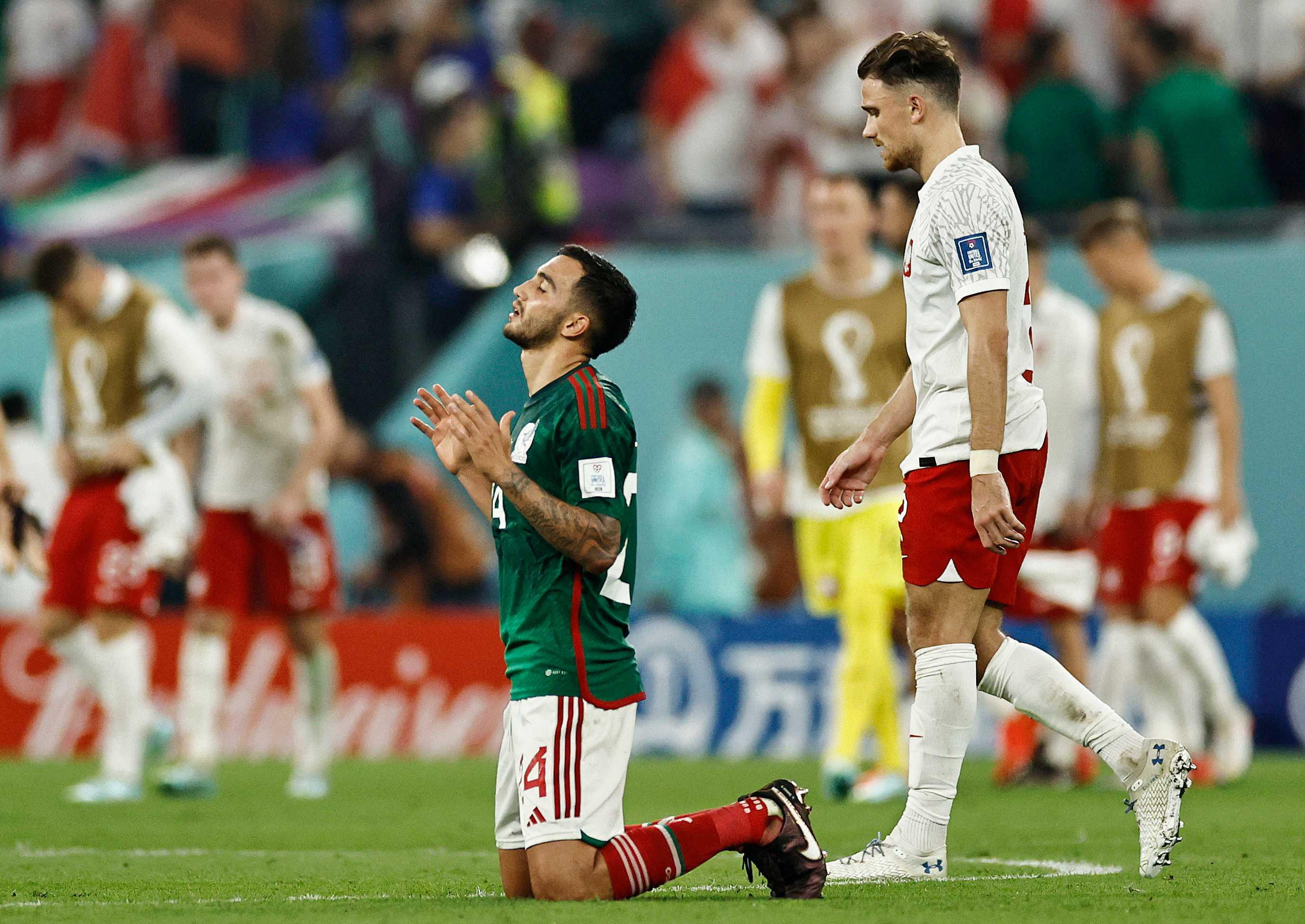 Fifa World Cup Qatar 2022 - Group C - Mexico v Poland - Stadium 974, Doha, Qatar - Nov 22, Mexico's Luis Chavez and Poland's Matty Cash react after the match. Photo: Reuters