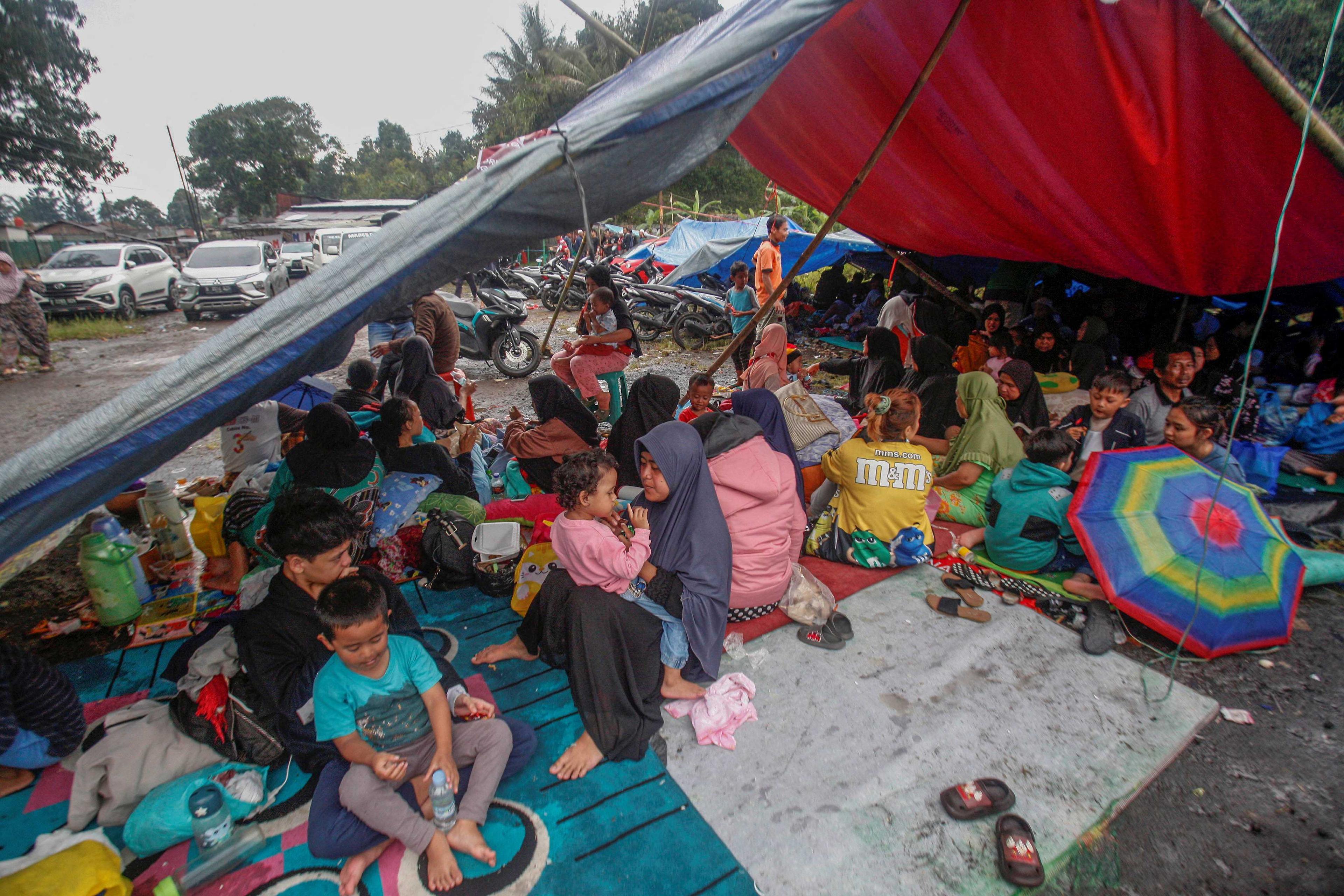 Locals are sheltered on a makeshift tent after earthquake hit in Cianjur, West Java province, Indonesia, Nov 22, in this photo taken by Antara Foto. Photo: Reuters