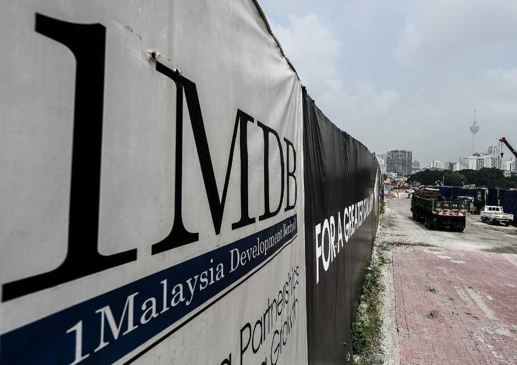 Former prime minister Najib Razak faces four charges of using his position to obtain bribes totalling RM2.3 billion from 1MDB funds and 21 charges of money laundering involving the same amount. Photo: AFP