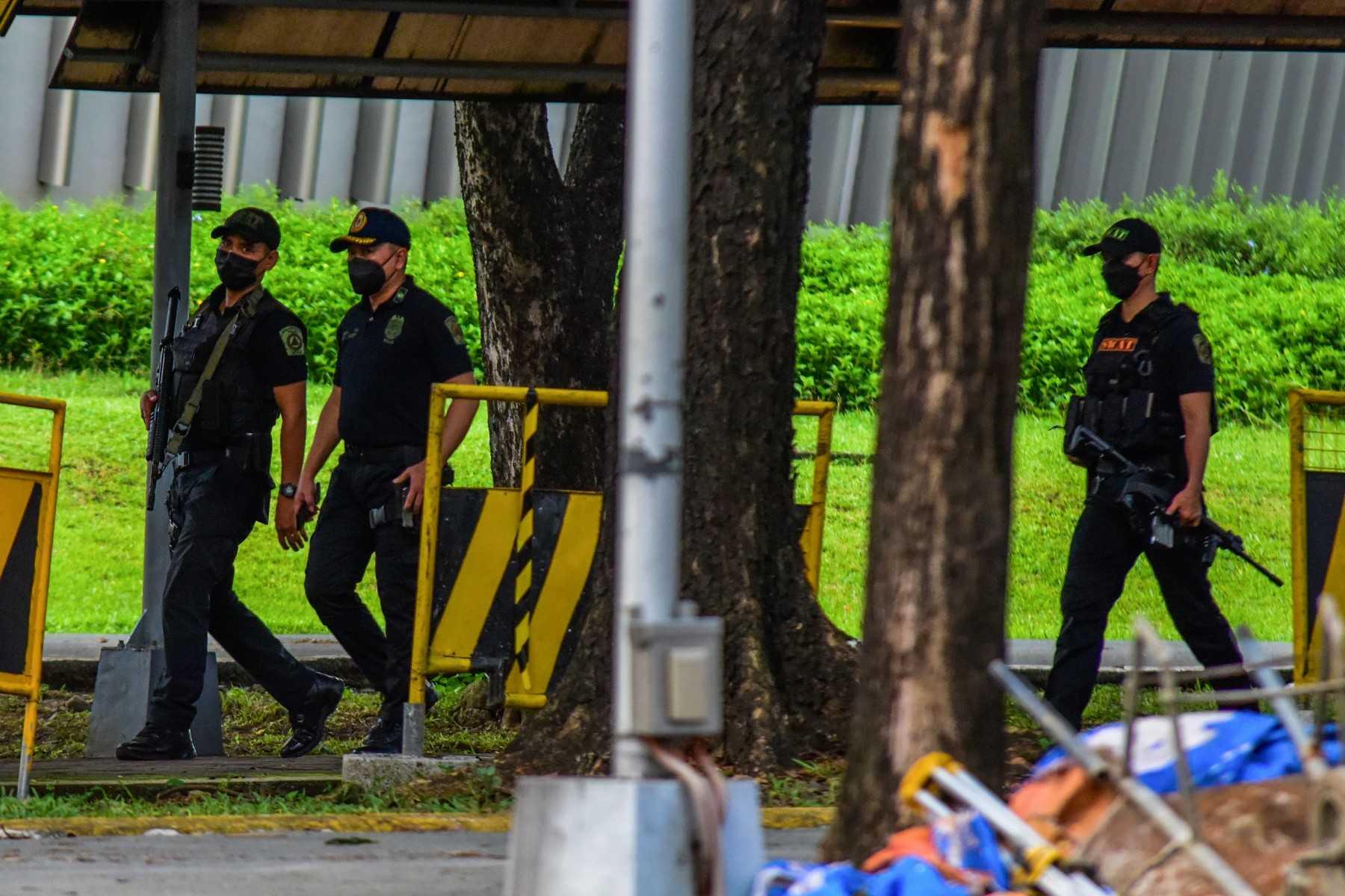 Police officers on patrol in the city of Quezon, suburban Manila, on July 24. Photo: AFP