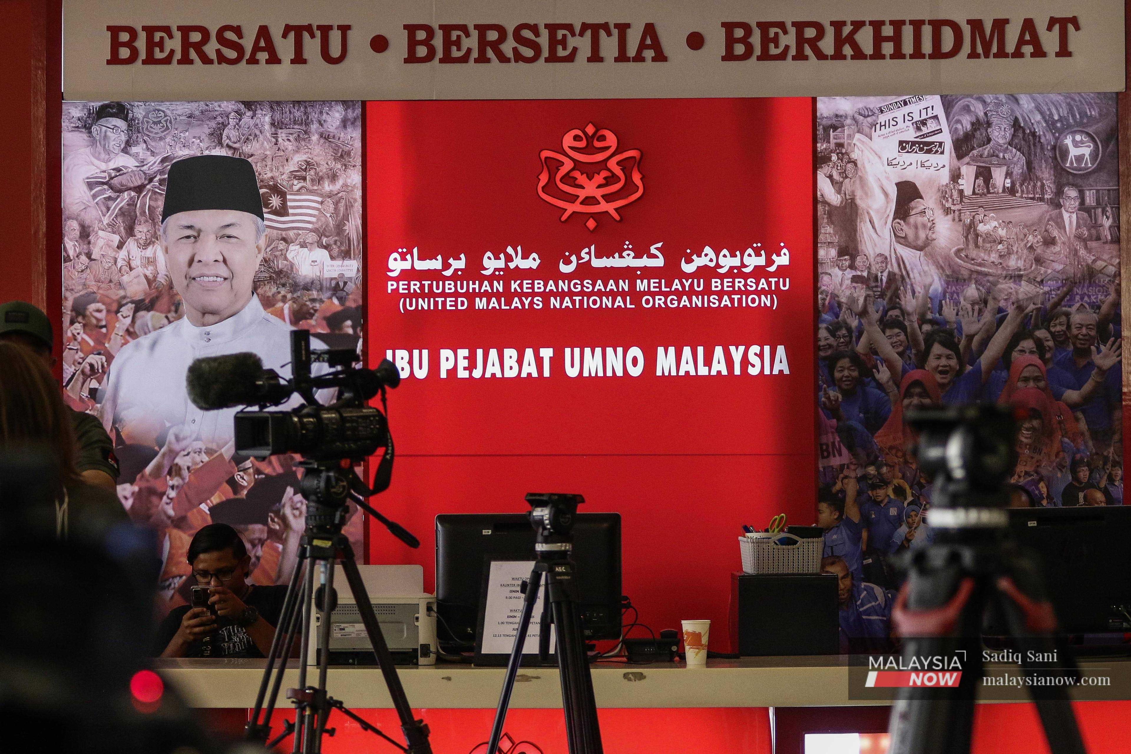 Reporters gather at the Umno headquarters at the World Trade Centre in Kuala Lumpur amid the ongoing political drama. 
