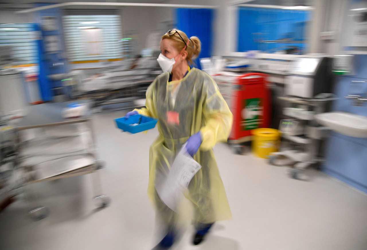 A nurse treats Covid-19 patients in the ICU of a hospital during the pandemic in Britain on Jan 20, 2021. Photo: Reuters
