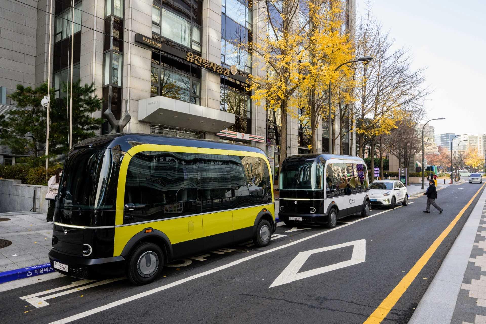 In this photo taken in Seoul on Nov 23,  buses are seen parked at one of two designated stops on the country's first self-driving bus route run by 42 Dot, a start-up owned by South Korea's Hyundai which created the autonomous driving technology. Photo: AFP 