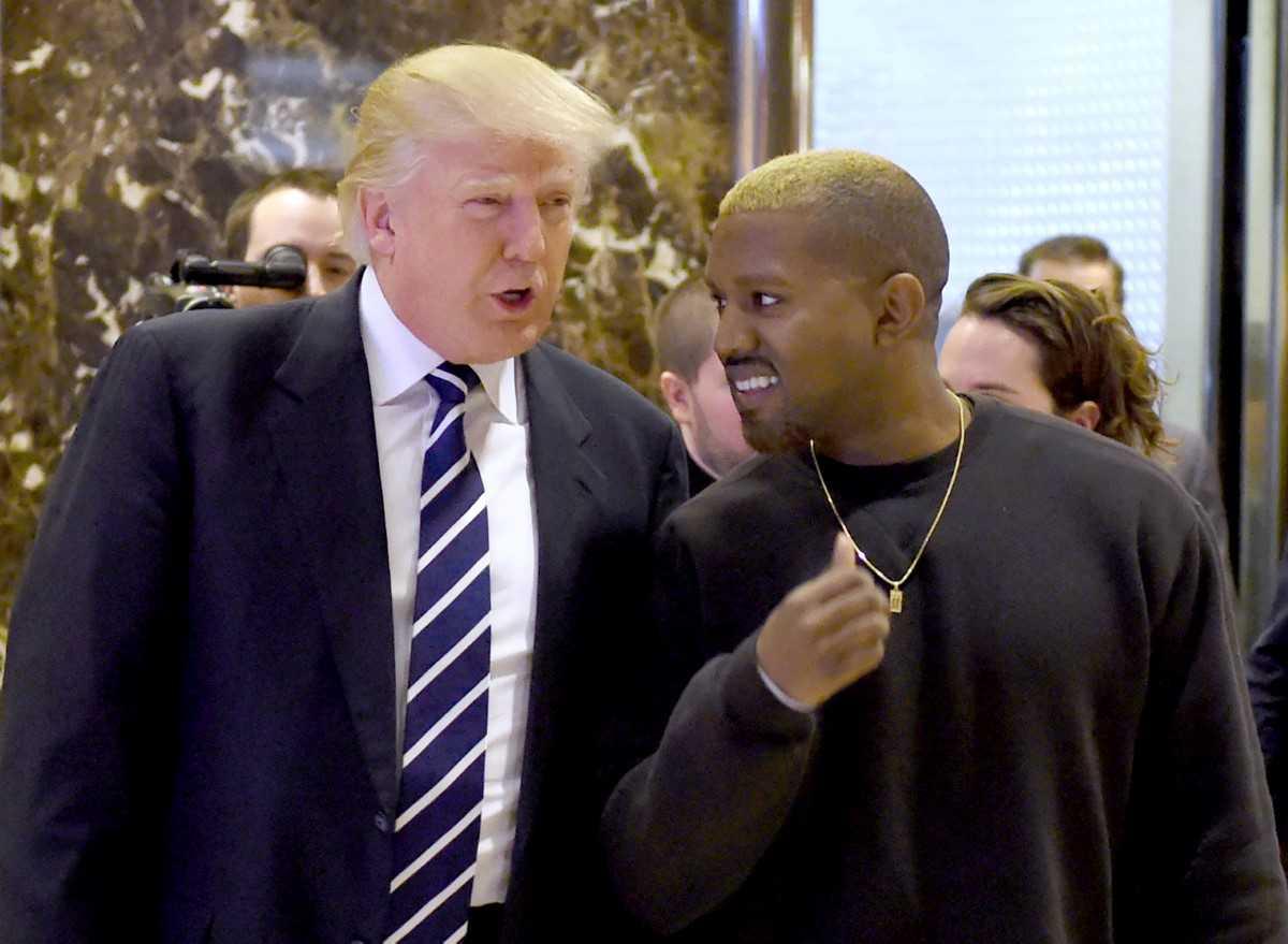 In this file photo taken on Dec 13, 2016, singer Kanye West and president-elect Donald Trump arrive to speak with the press after a meeting at Trump Tower in New York. Photo: AFP
