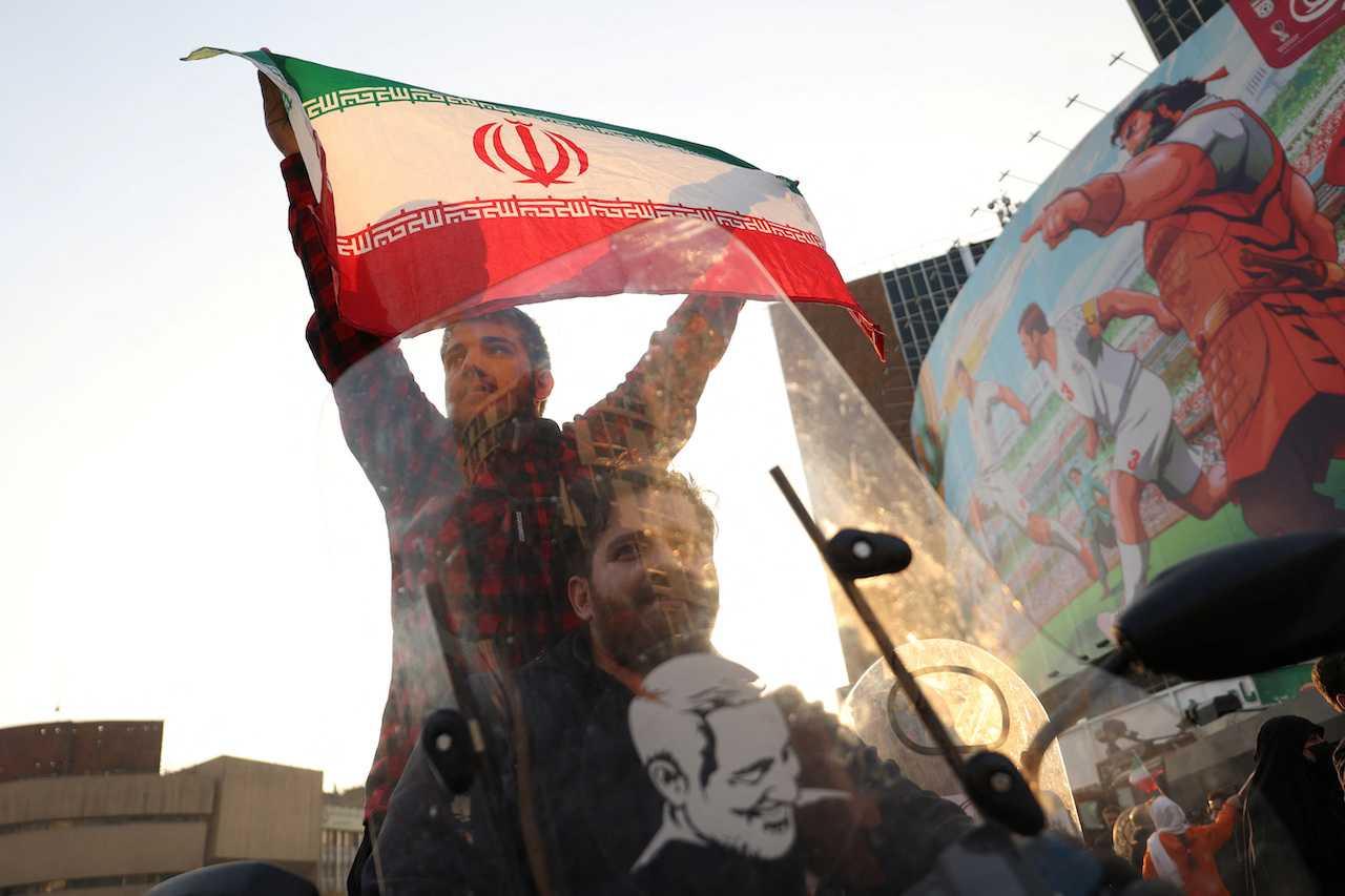 Fans in Tehran celebrate after the Wales vs Iran match in Tehran, Iran, Nov 25. Photo: Reuters
