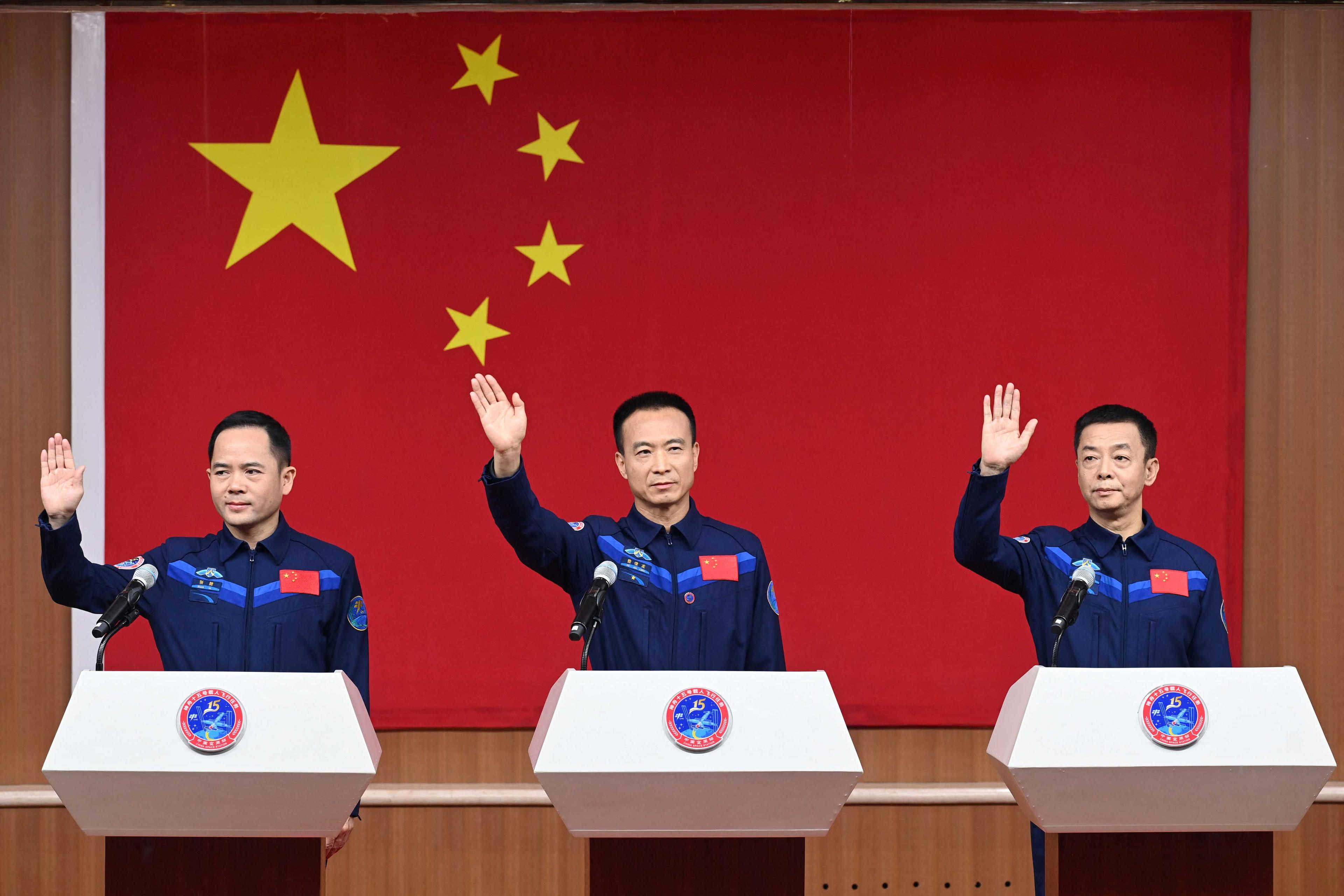 Astronauts Fei Junlong, Deng Qingming and Zhang Lu attend a news conference at Jiuquan Satellite Launch Center, near Jiuquan, Gansu province, China Nov 28. Photo: Reuters