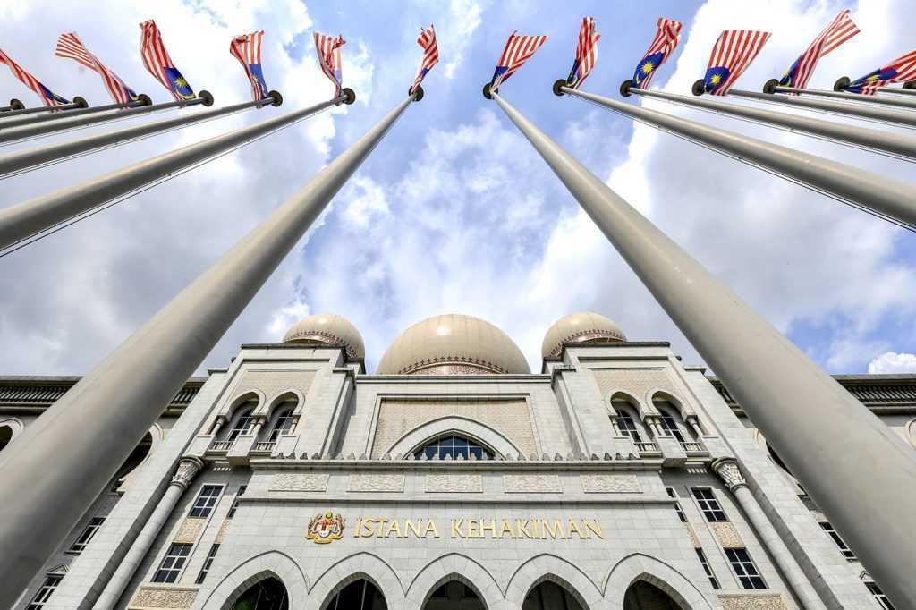 Malaysian flags wave in the breeze outside the Istana Kehakiman complex in Putrajaya which houses the Court of Appeal and Federal Court. Photo: Bernama
