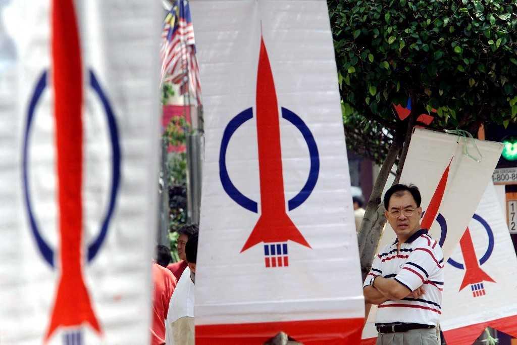 A man stands among DAP banners in Kuala Lumpur in this 2001 file picture. Photo: AFP
