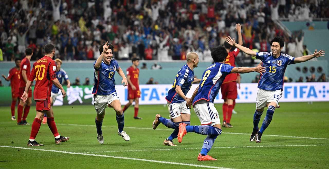 Japan's Ao Tanaka celebrates scoring their second goal with teammates at Khalifa International Stadium in Doha, Qatar, Dec 1. Photo: Reuters
