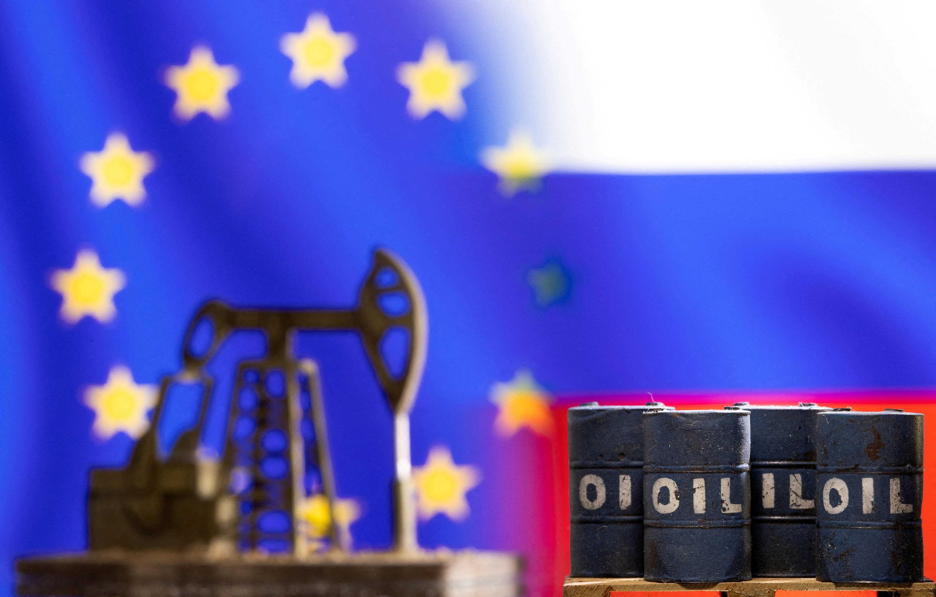 Models of oil barrels and a pump jack are seen in front of displayed EU and Russia flag colours in this illustration taken March 8. Photo: Reuters