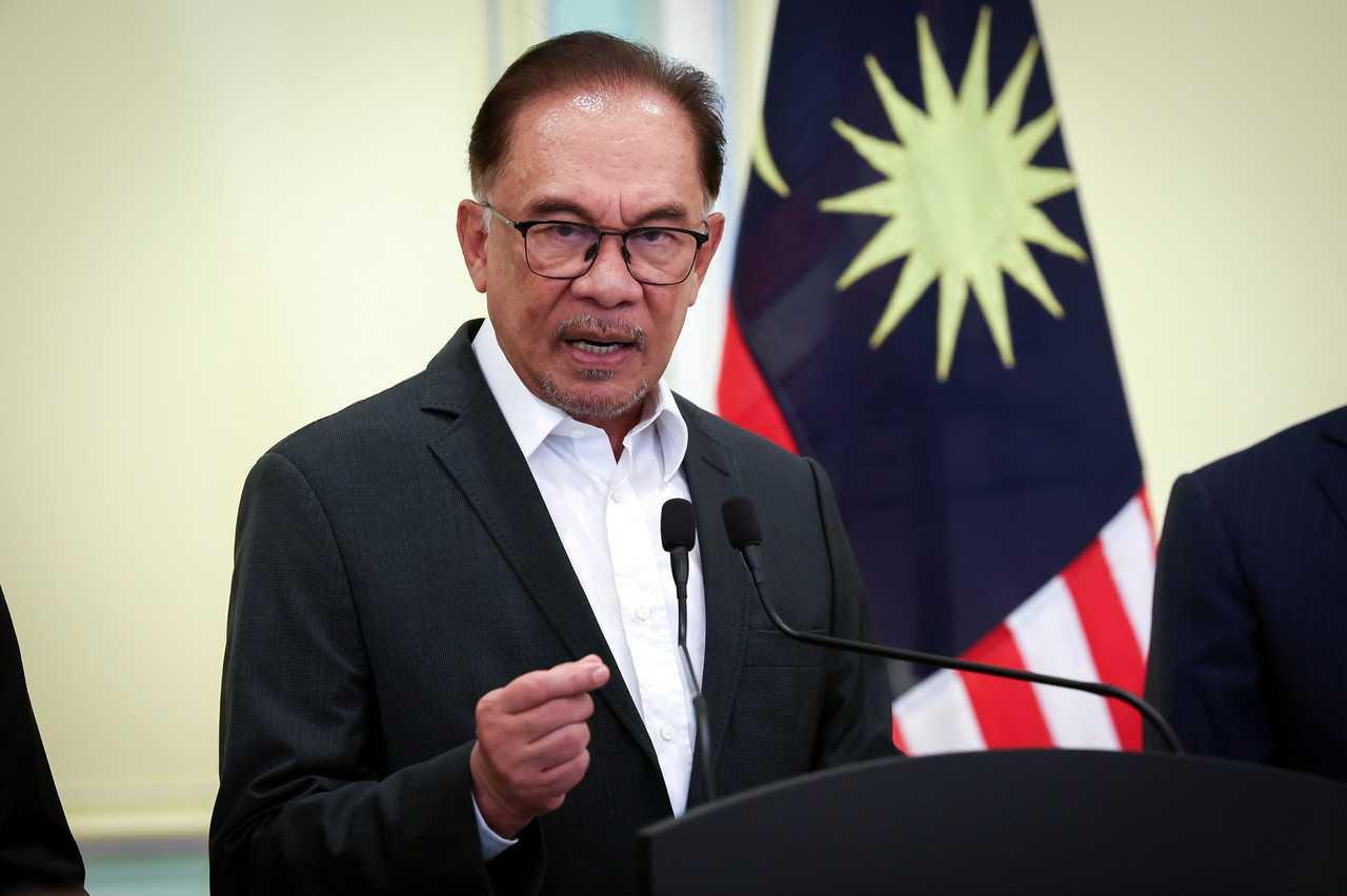 Prime Minister Anwar Ibrahim speaks at a press conference in Putrajaya today. Photo: Bernama