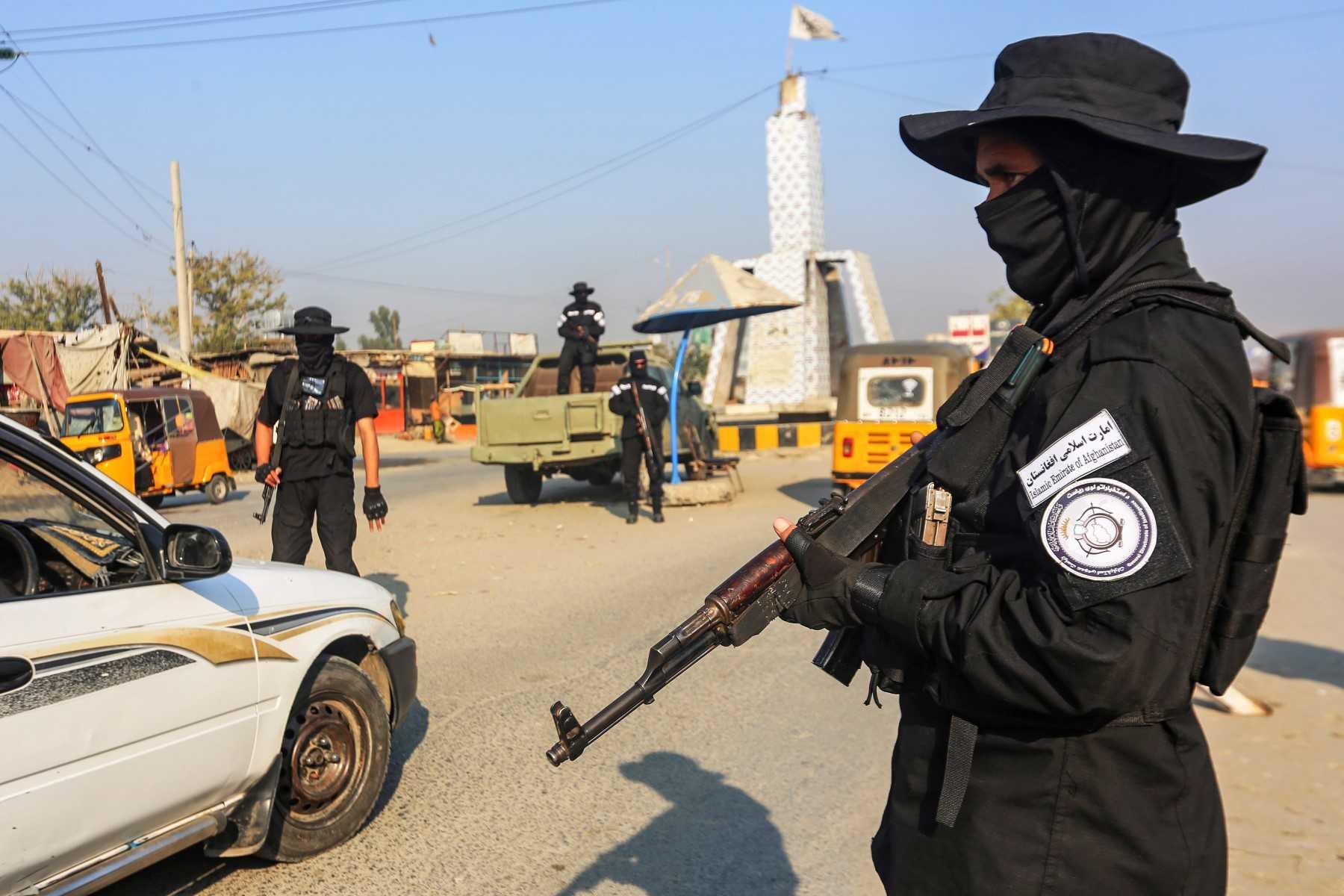 A member of the Taliban security forces stands guard at a checkpoint along a street in Jalalabad on Dec 6. Photo: AFP