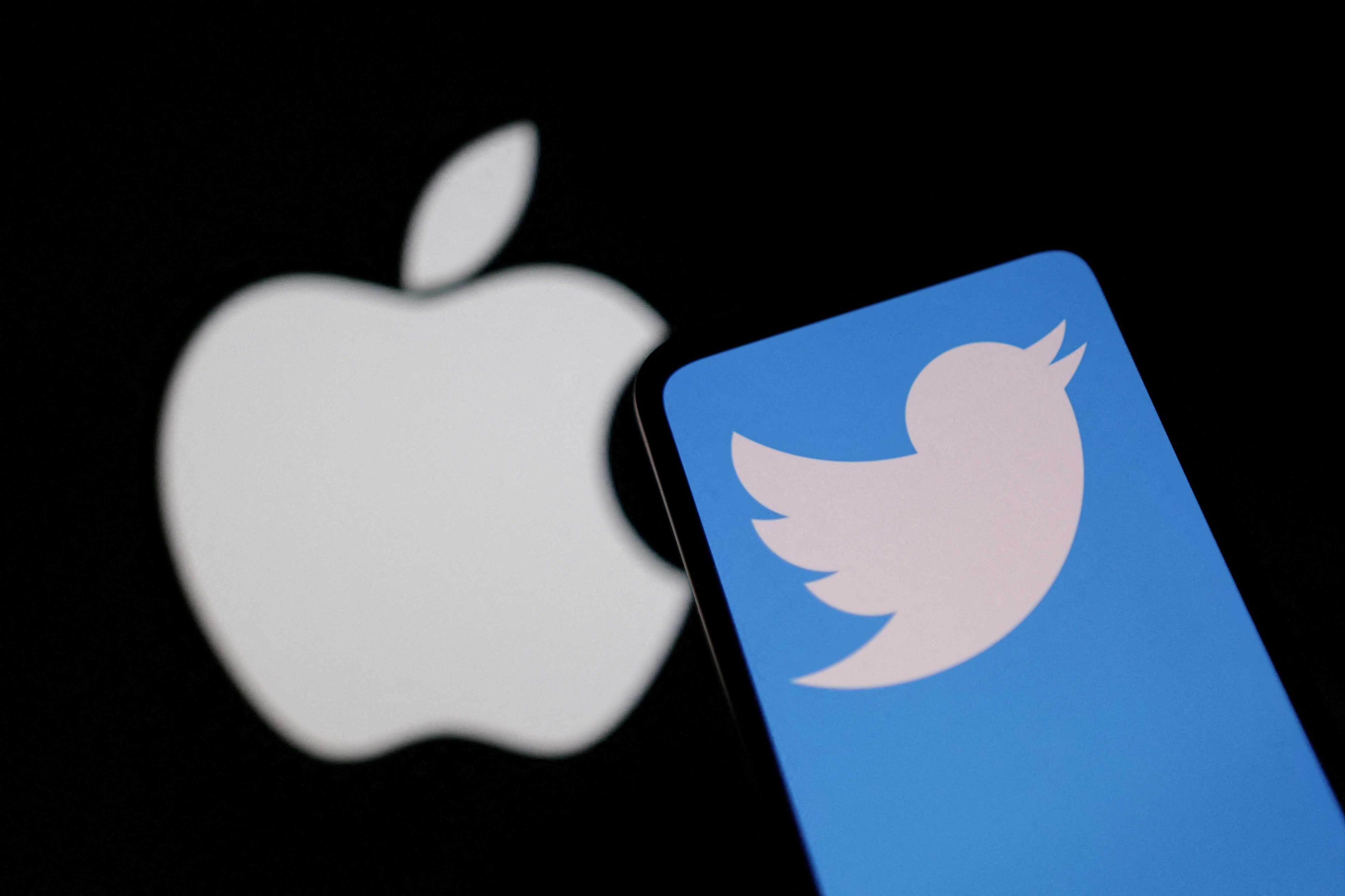 Smartphone with displayed Twitter logo is seen in front of Apple logo in this illustration taken, Nov 29. Photo: Reuters