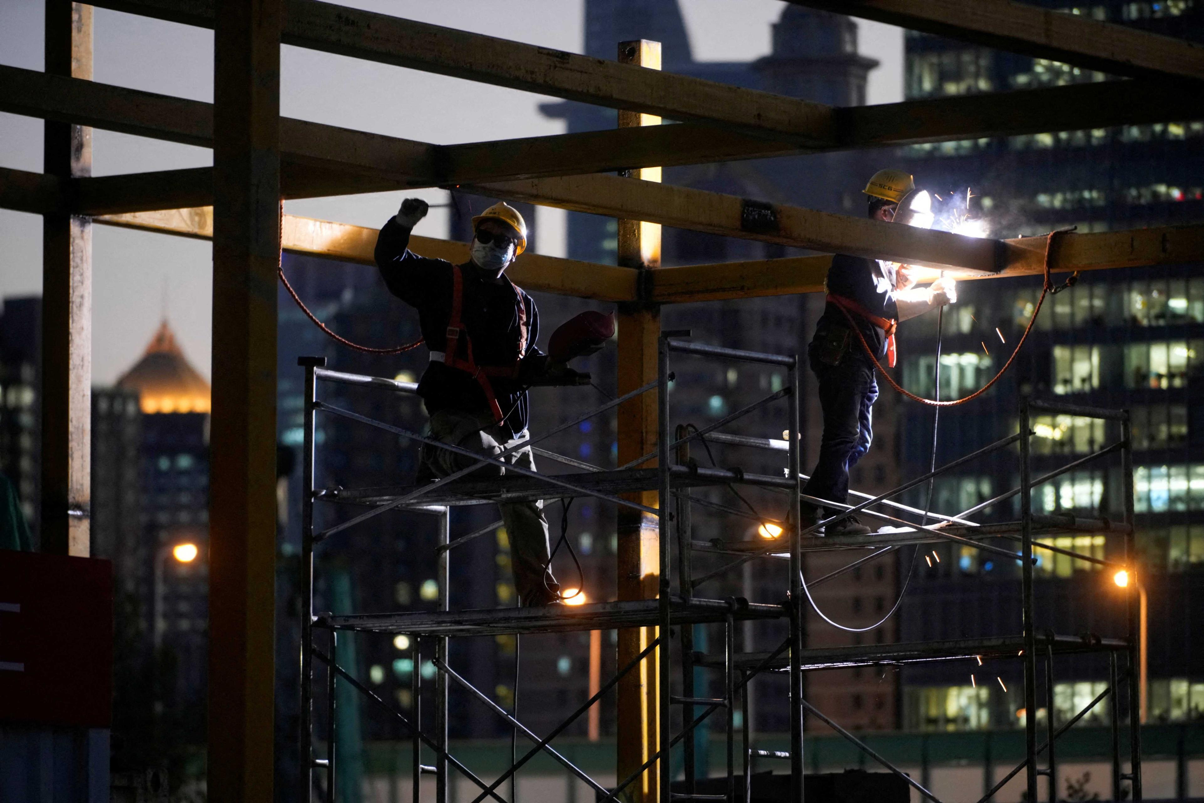Workers work at a construction site in Shanghai, China, Oct 13. Photo: Reuters