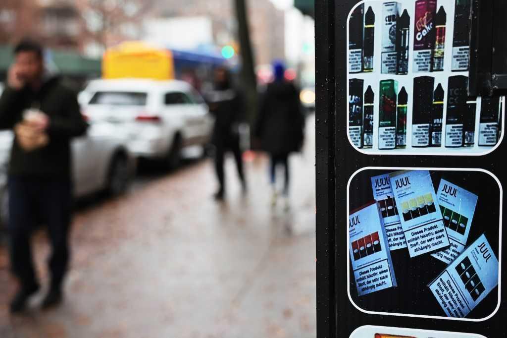 A Juul advertisement is seen at a grocery store on Dec 7, in a neighbourhood of Brooklyn borough in New York City. Photo: AFP