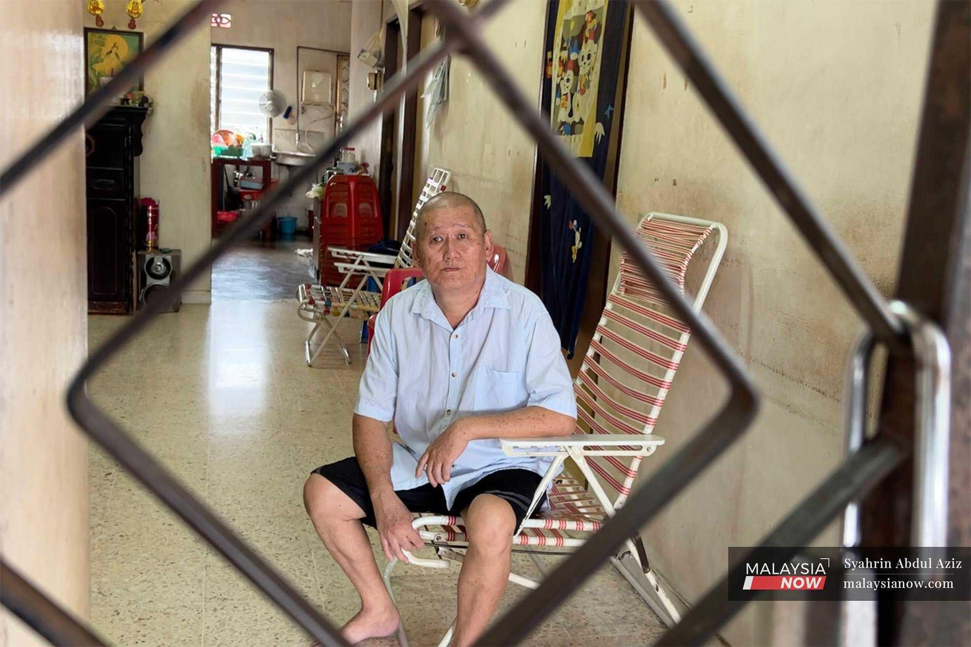 Former security guard Lim Bun Lai, who is blind due to diabetes, in his home in Padang Terap, Kedah.
