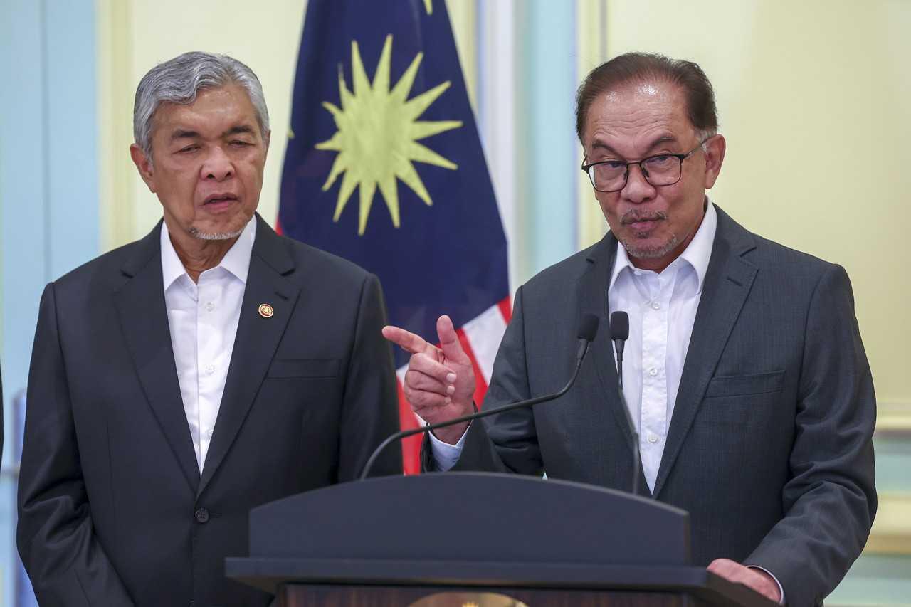 Prime Minister Anwar Ibrahim with his deputy Ahmad Zahid Hamidi at a press conference in Putrajaya on Dec 5. Photo: Bernama
