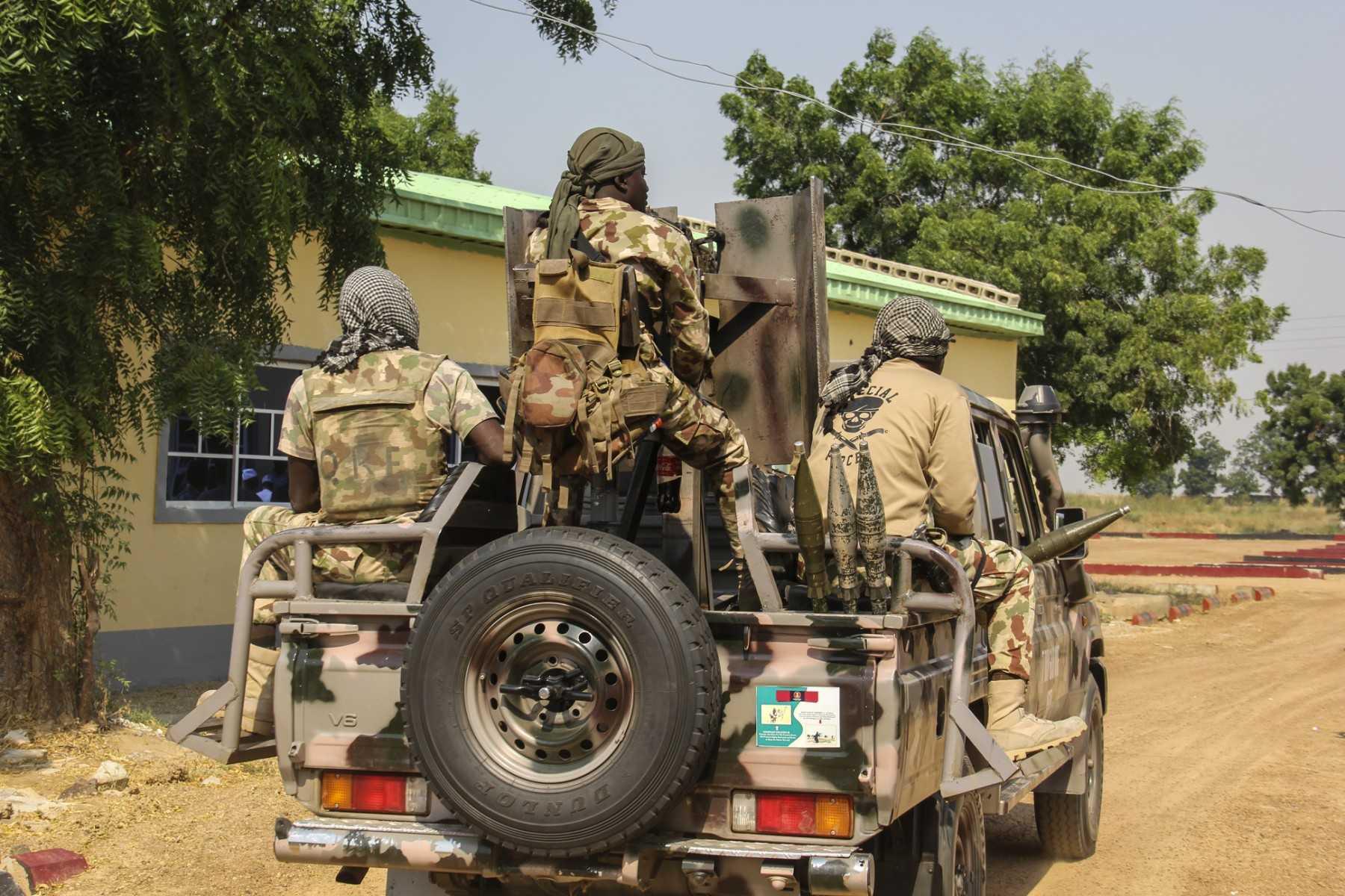 Nigerian Army soldiers are seen driving on a military vehicle in Ngamdu, Nigeria, on Nov 3. Photo: AFP