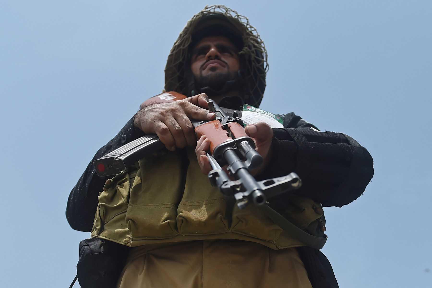 A police commando stands guard in Karachi on Aug 7. Photo AFP