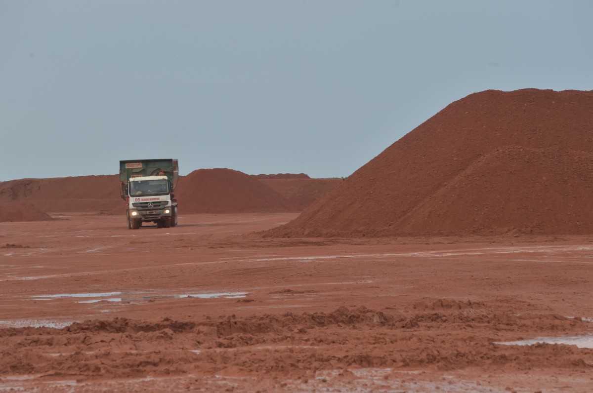 A truck carries material next to piles of bauxite at a mine in Kendawangan, West Kalimantan. Photo: AFP