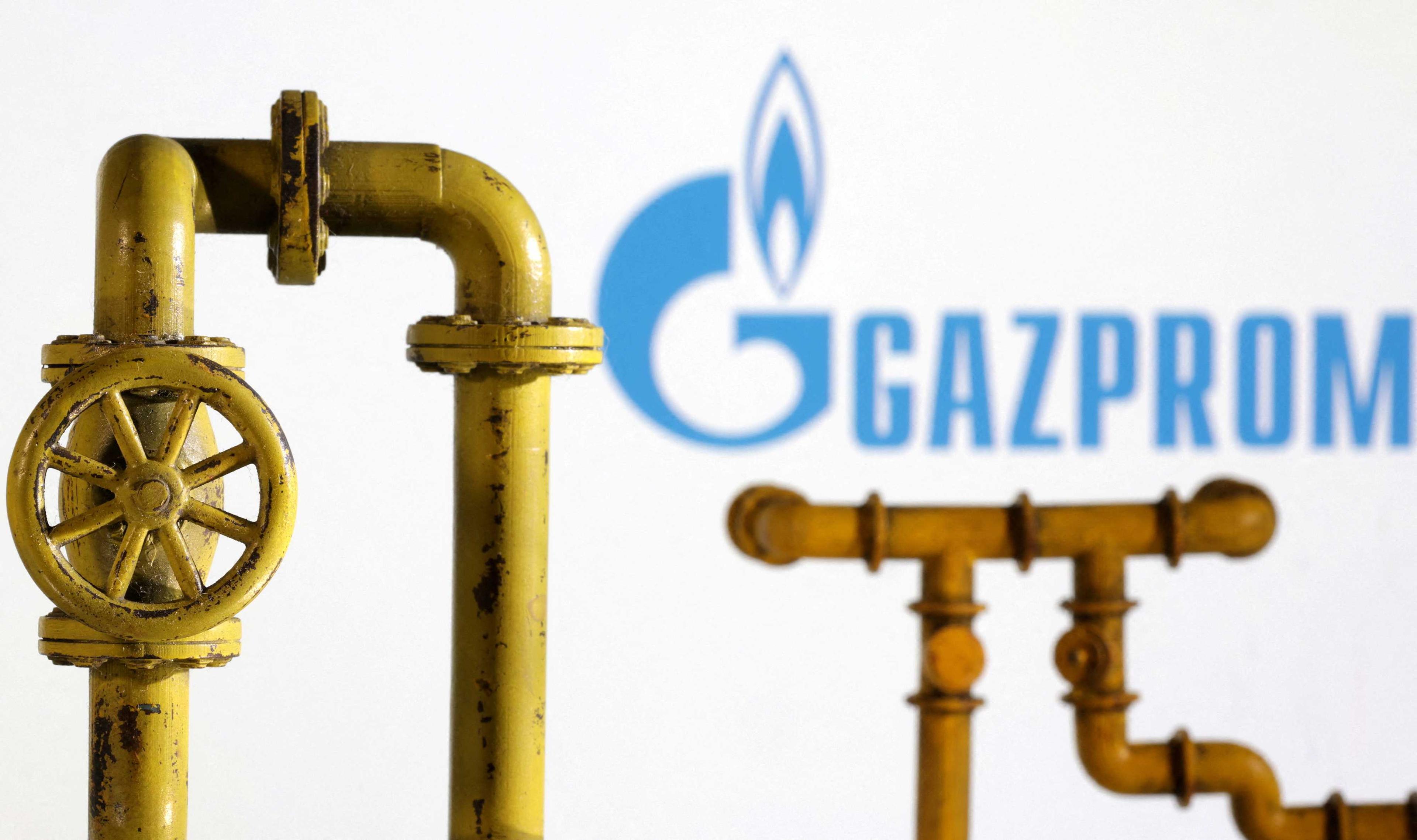 Model of natural gas pipeline and Gazprom logo, July 18. Photo: Reuters