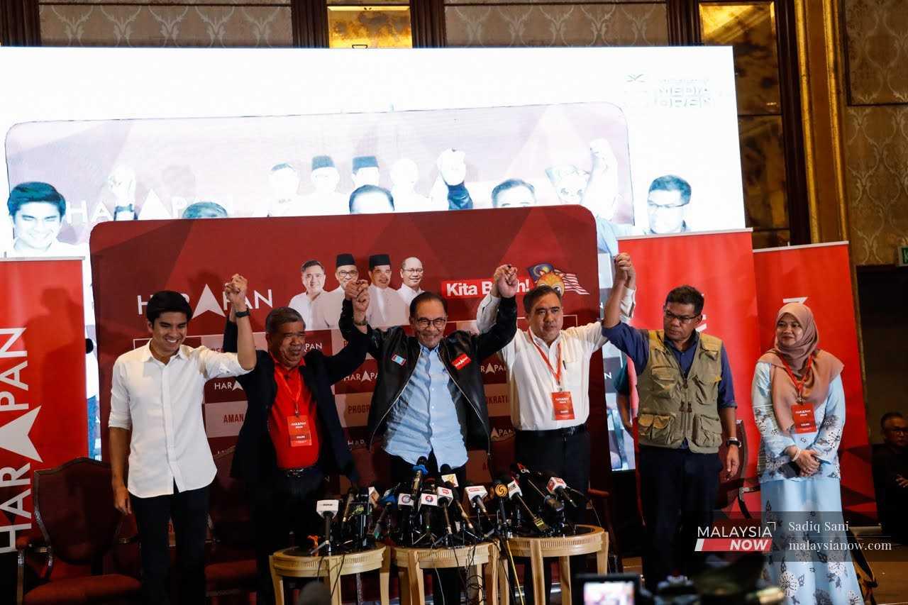 Pakatan Harapan leaders led by their chairman Anwar Ibrahim celebrate the coalition's victory in 81 seats – the most won by any coalition at the Nov 19 polls. 
