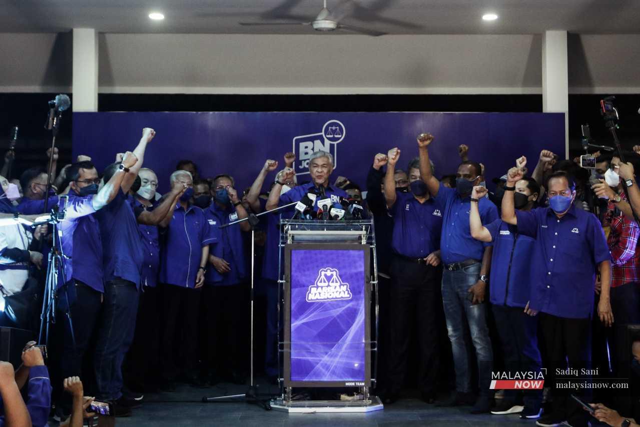 Barisan Nasional chairman Ahmad Zahid Hamidi celebrates with other party leaders after the results of the Johor election on March 12. 